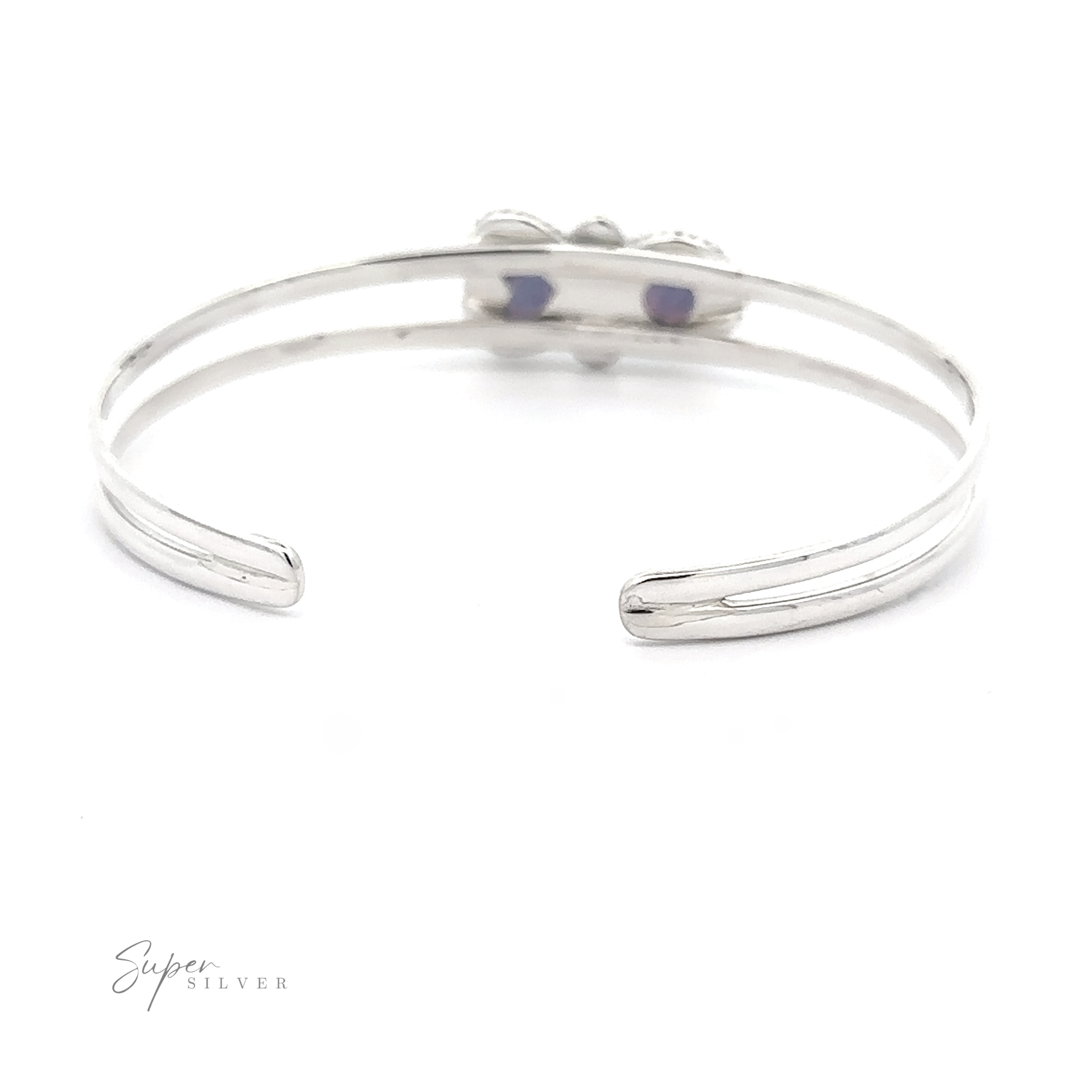 A sterling silver bracelet with a minimalistic design, featuring the brand name "Opal Heart And Circle Cuff Bracelet" in the bottom left corner. This romantic jewelry piece captures elegance effortlessly.