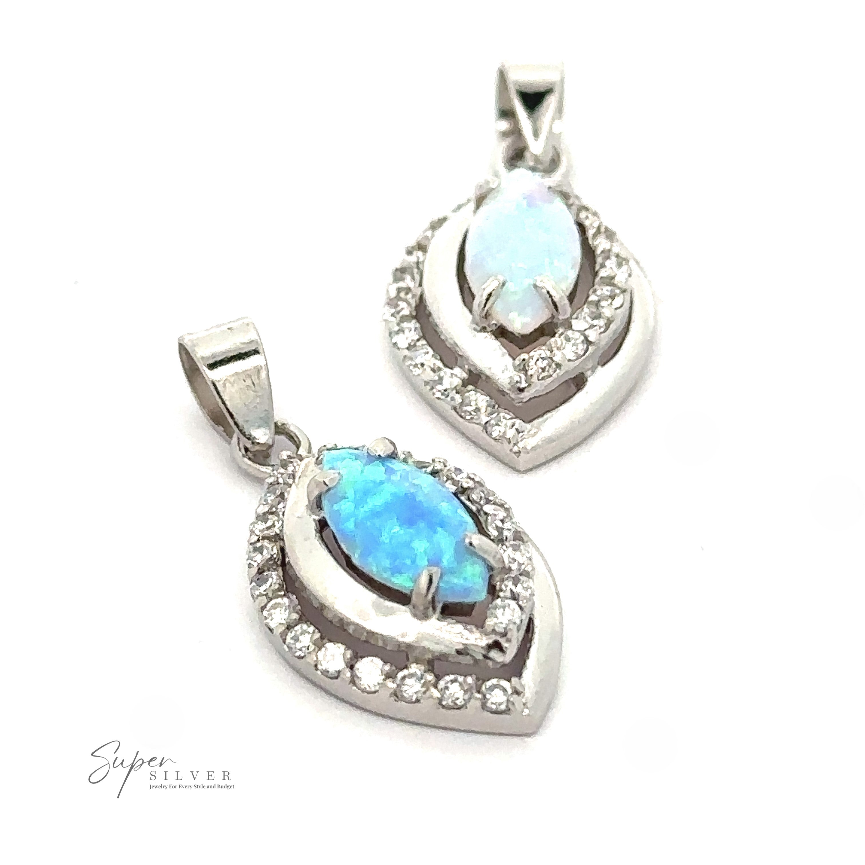 Two Opal Pendants with Cubic Zirconia, each surrounded by a halo of small clear cubic zirconia stones, displayed on a white background. This exquisite Art Deco jewelry captures timeless elegance and sophistication.