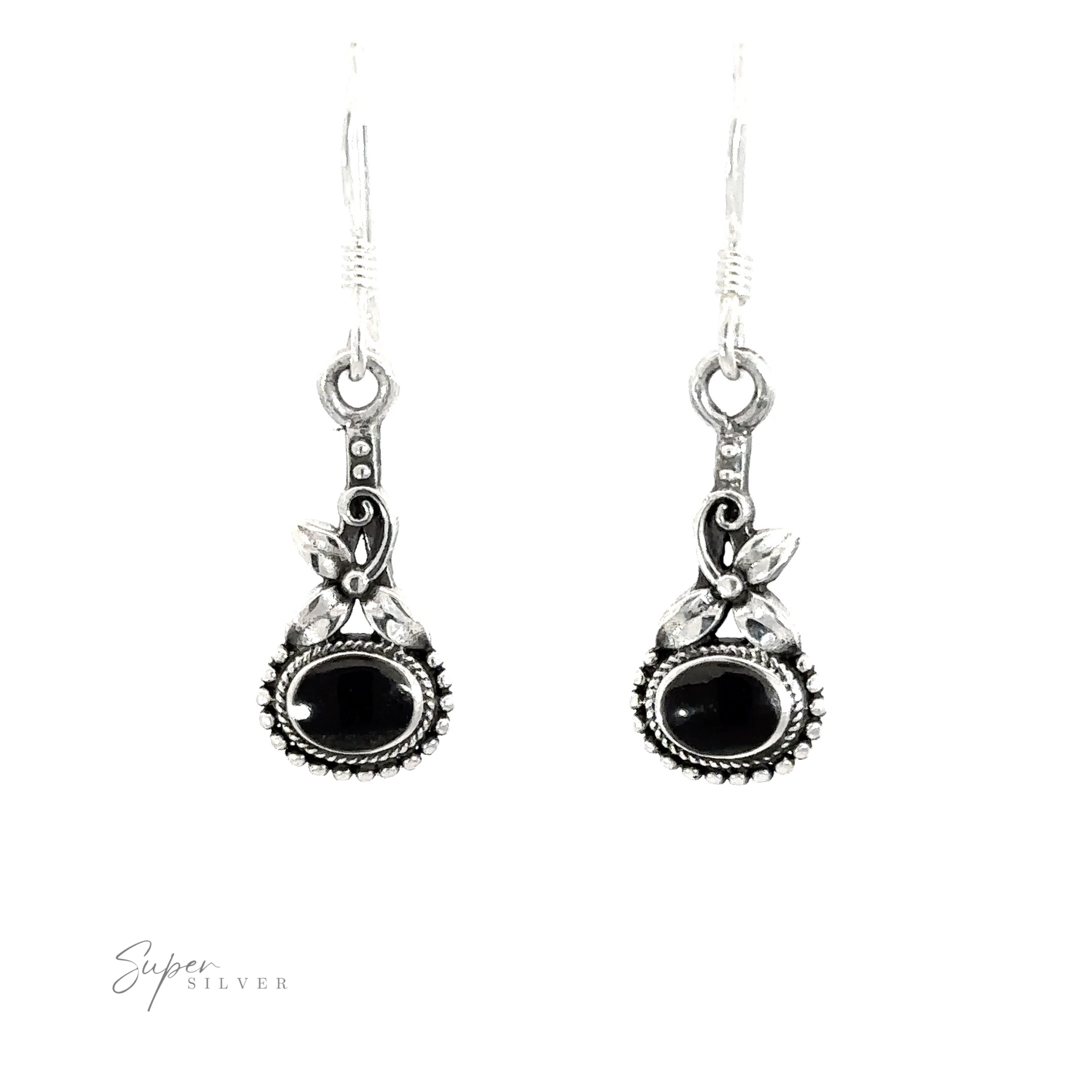 A pair of Inlaid Flower Earrings with Oval Stone with vintage charm and black stones.