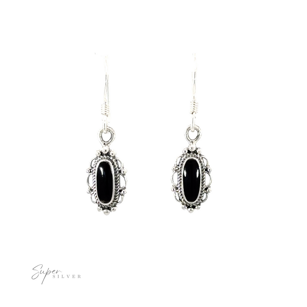 
                  
                    Dainty Vintage Inspired Oval Inlaid Stone Earrings with a black stone.
                  
                