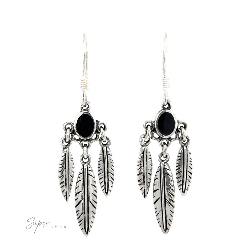 
                  
                    Western Inspired Earrings With Feather Dangles and Inlay Stones featuring black oval, organic gemstones.
                  
                