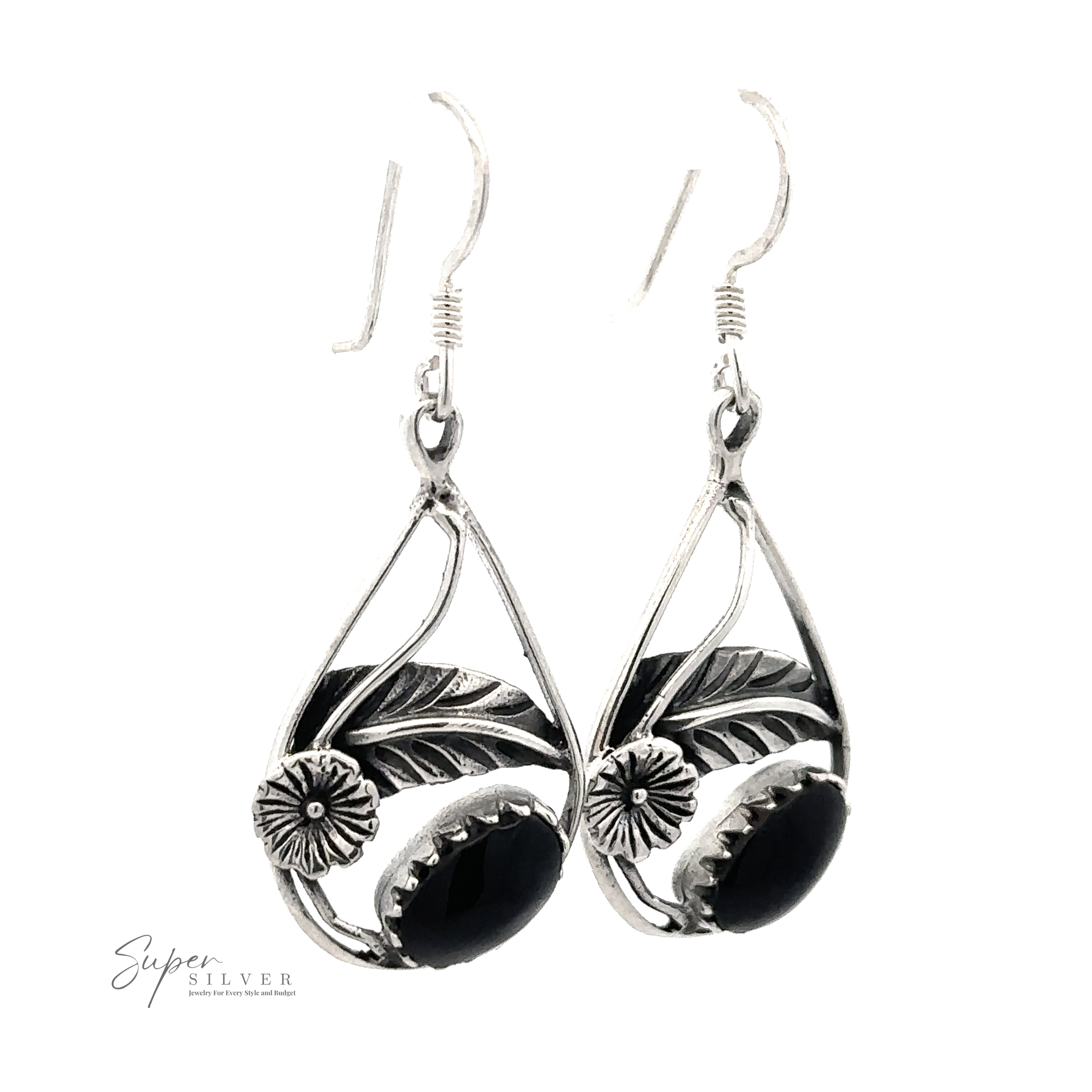 Pair of Inlaid Teardrop Earrings With Floral Setting with black stones and a floral leaf design.