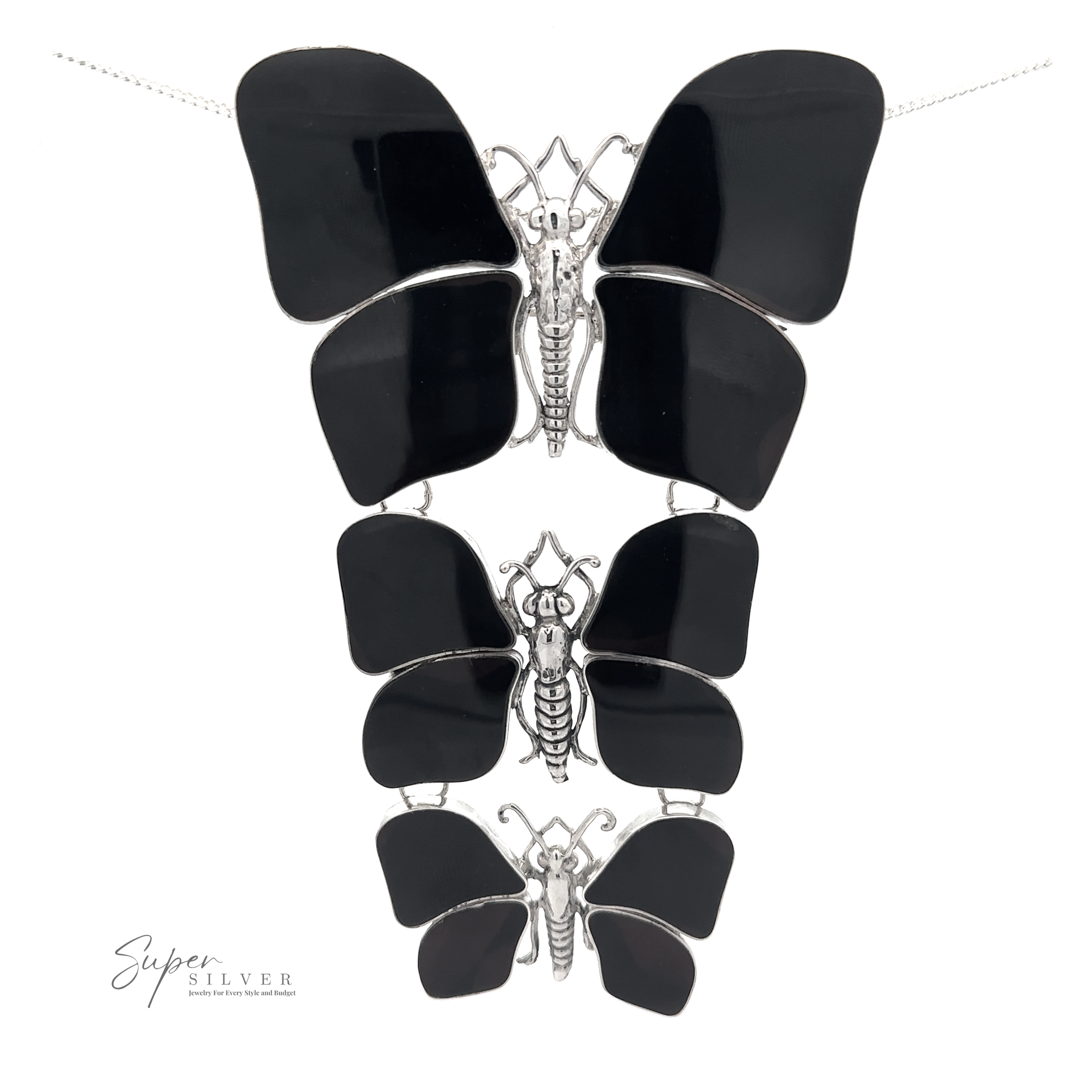 A Statement Pendant or Brooch with Three Butterflies of varying sizes arranged vertically. Perfect for the nature lover, the brand name "Super Silver" is visible in the bottom left corner.