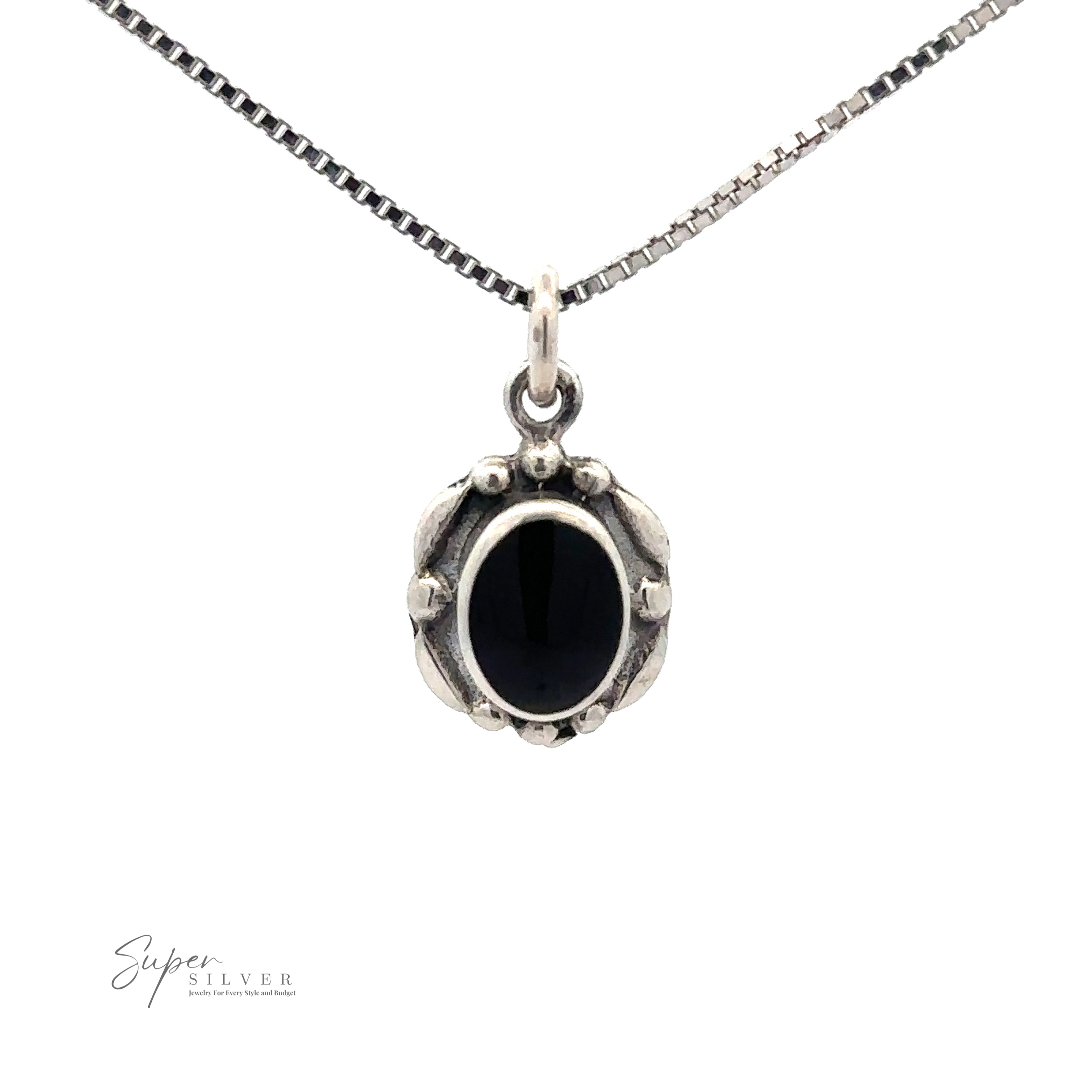 A Beautiful Oval Stone Pendant With Silver Border, displayed against a white background. The pendant has a detailed frame and hangs from a thin chain.
