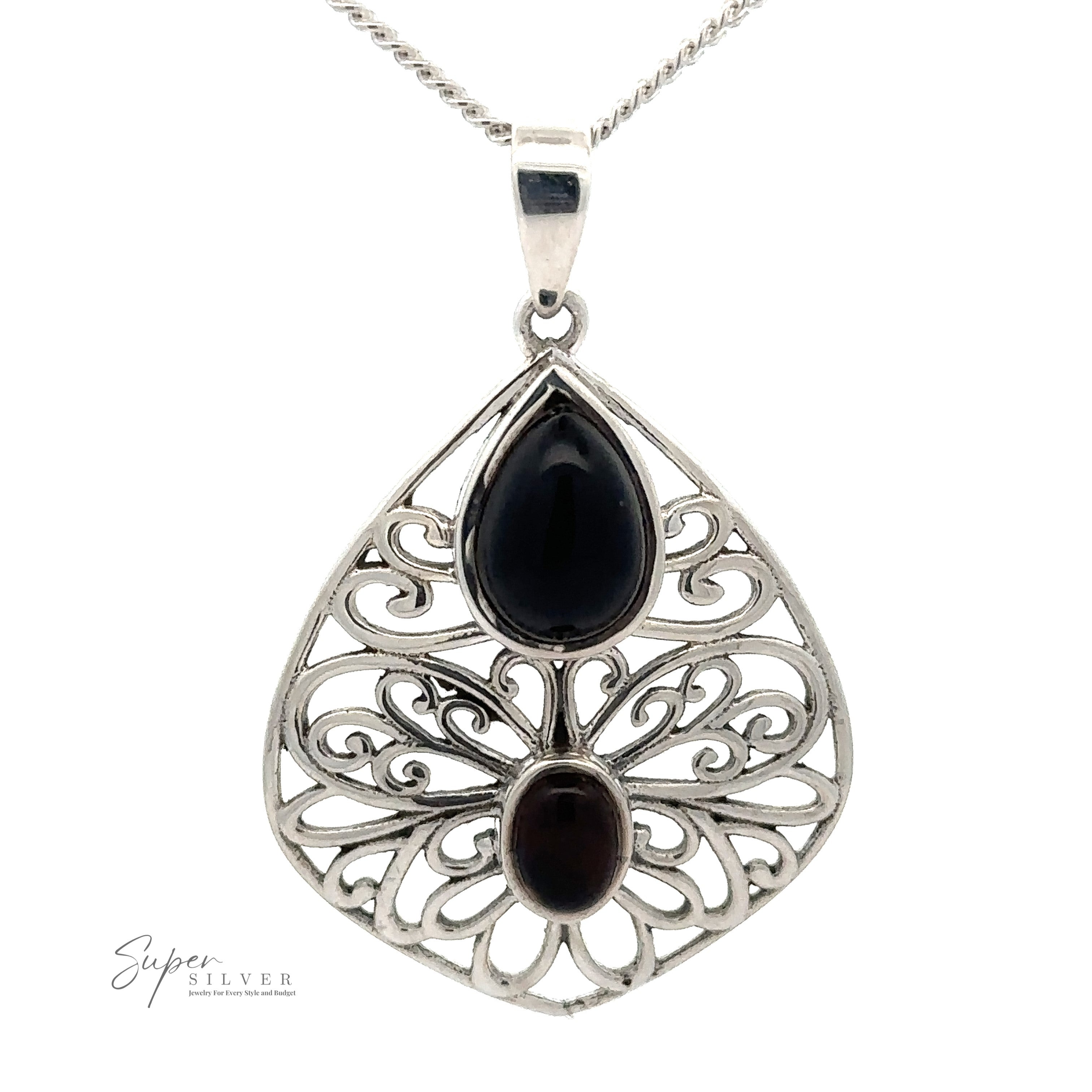 A Teardrop Filigree Gemstone Pendant featuring intricate designs with one teardrop-shaped Onyx stone and one oval-shaped dark brown stone, hung on a thin silver chain.