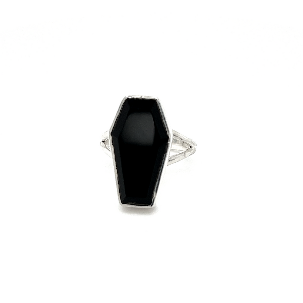 A spooky Super Silver faceted onyx coffin ring on a white background, exuding gothic mystique.