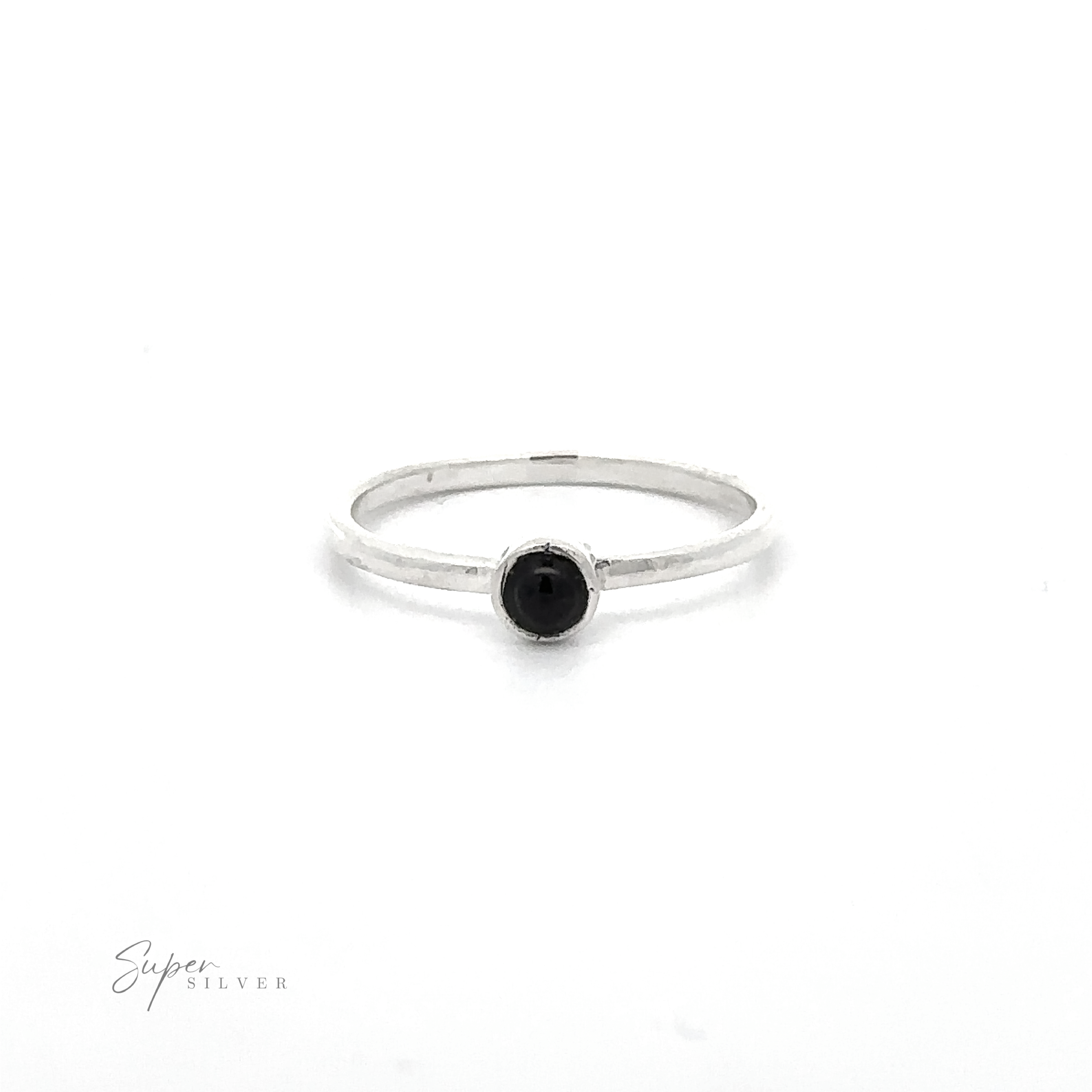 A simple silver ring featuring a small, round black gemstone in its center, perfect for minimalist fashion. The thin band adds to its elegant simplicity. Made of sterling silver, this Dainty Stackable Round Gemstone Ring has "Super Silver" visible in the bottom left corner.