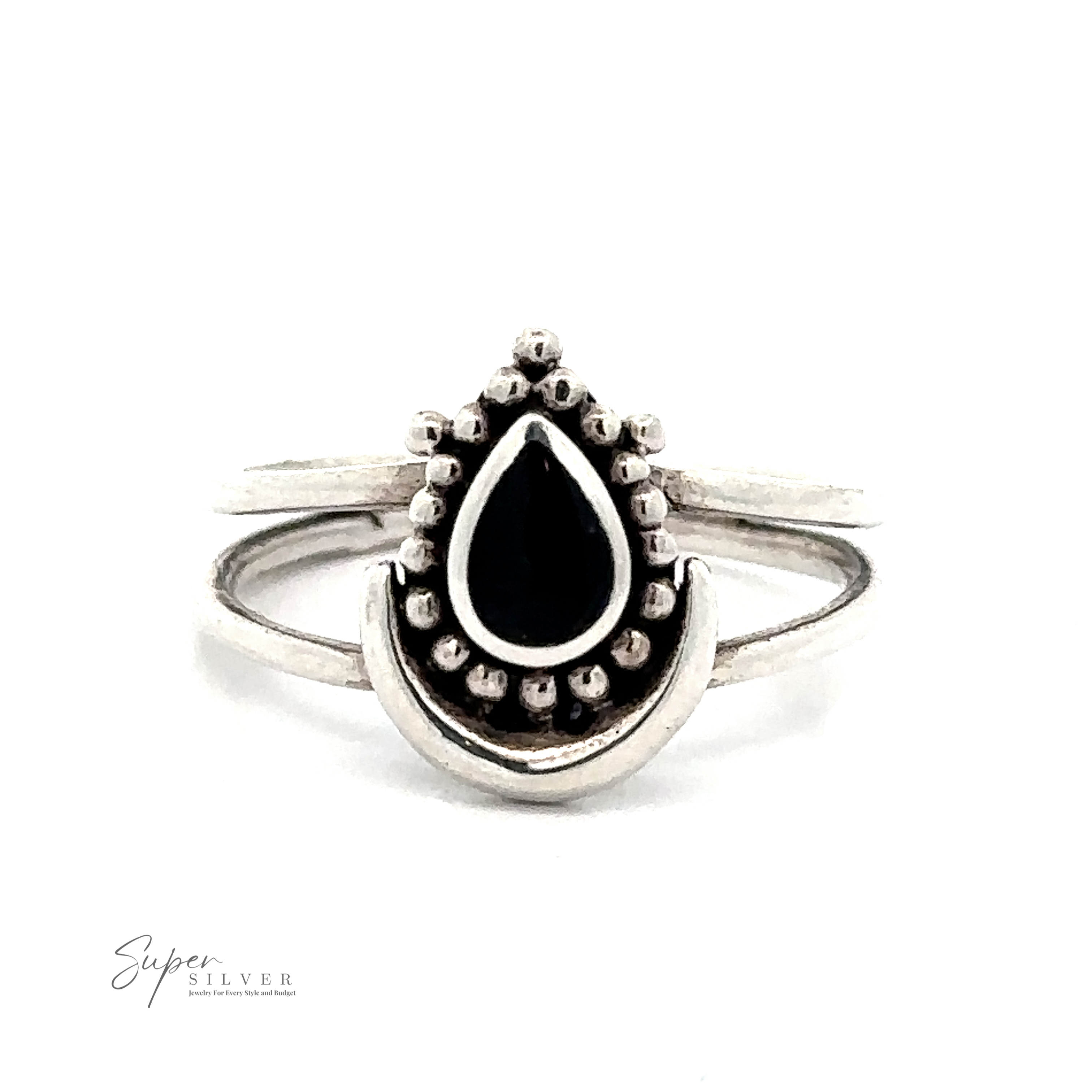 A silver ring with a black teardrop-shaped central gem surrounded by small silver beads on a white background. The words "Teardrop Ring With Inlaid Stone and Crescent Moon" are visible in the bottom left corner, showcasing intricate Bali-inspired silverwork.