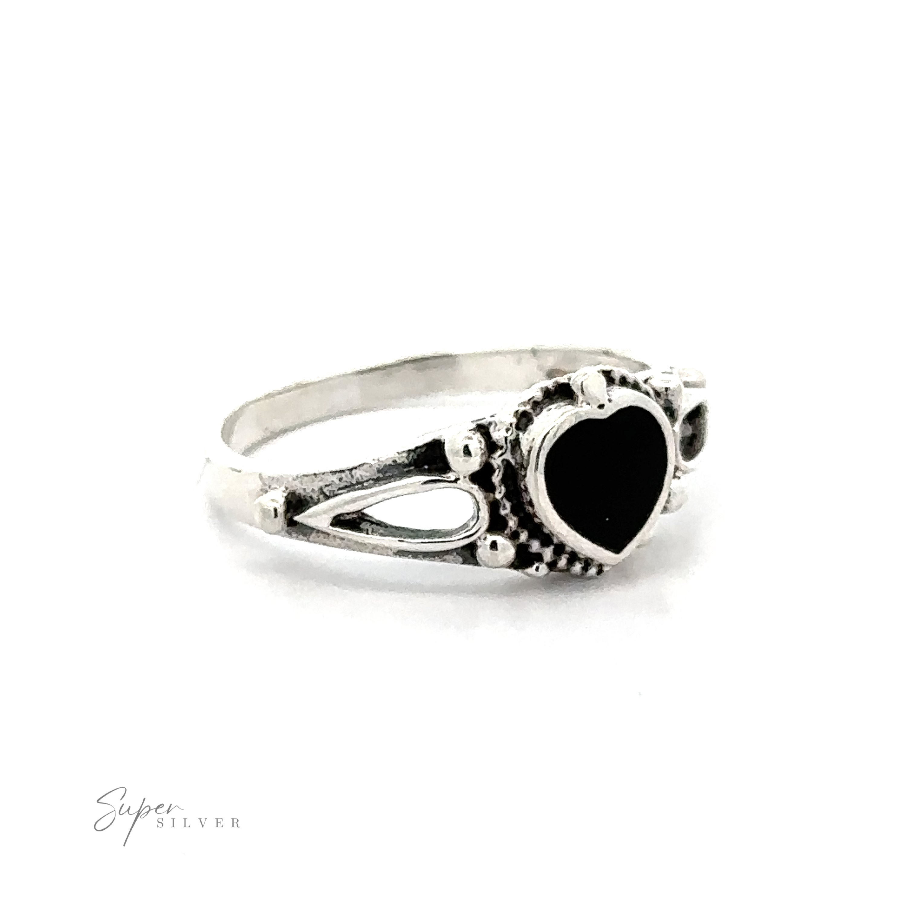 Inlaid Stone Heart Ring featuring a black heart-shaped inlaid stone with filigree details.