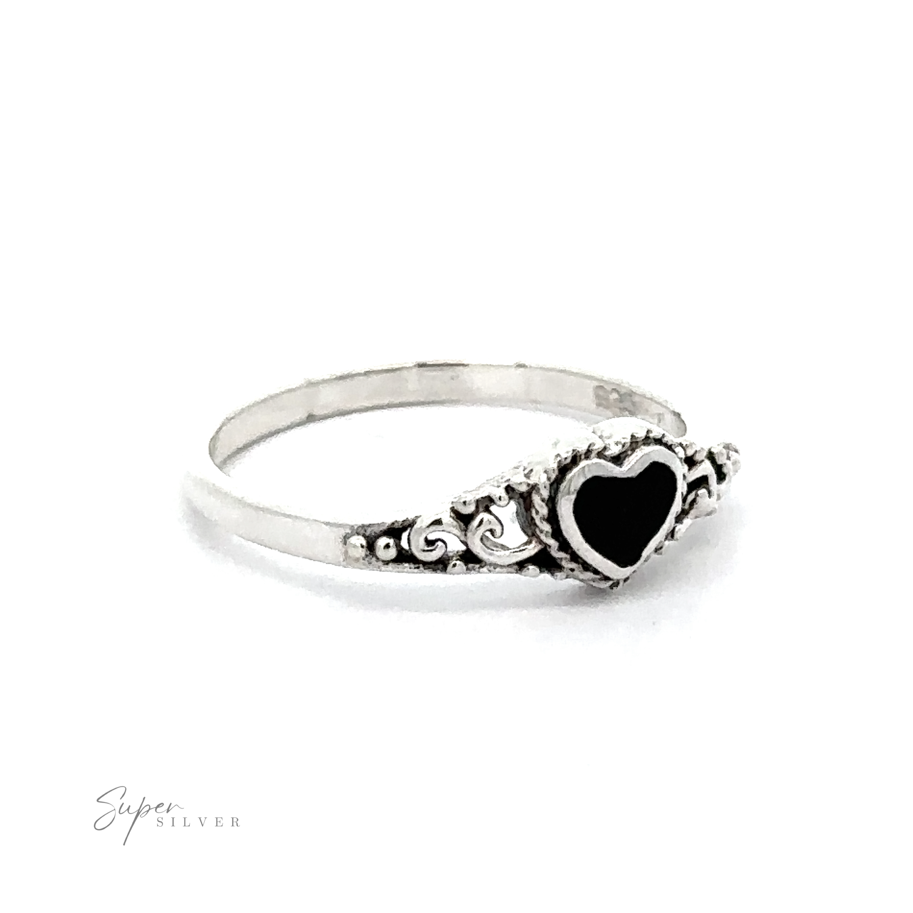A Dainty Heart Filigree Ring with Inlaid Stones with Bali-style filigree design on a white background.