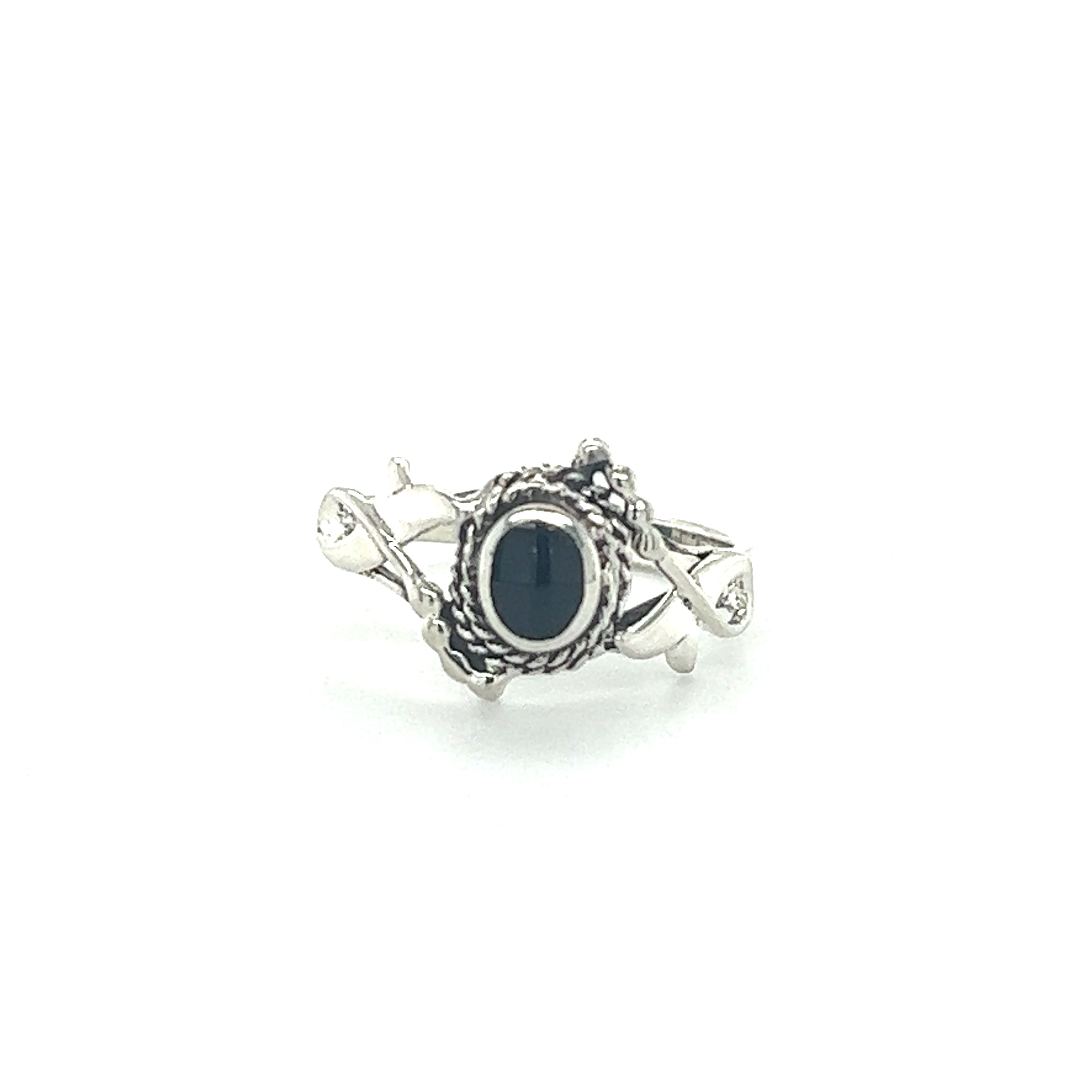 A Decorated Freeform Inlay Stone ring with an inlaid black onyx stone, giving off a Super Silver boho vibe.