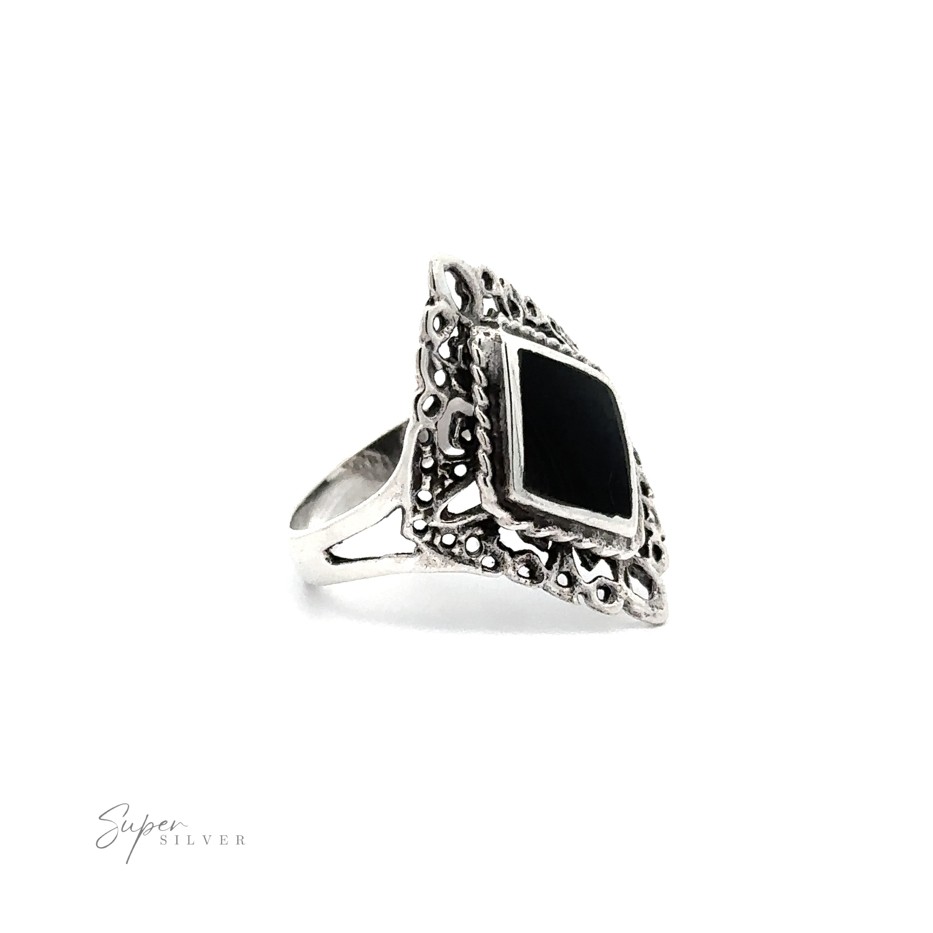 A diamond shaped filigree ring with inlaid stones.
