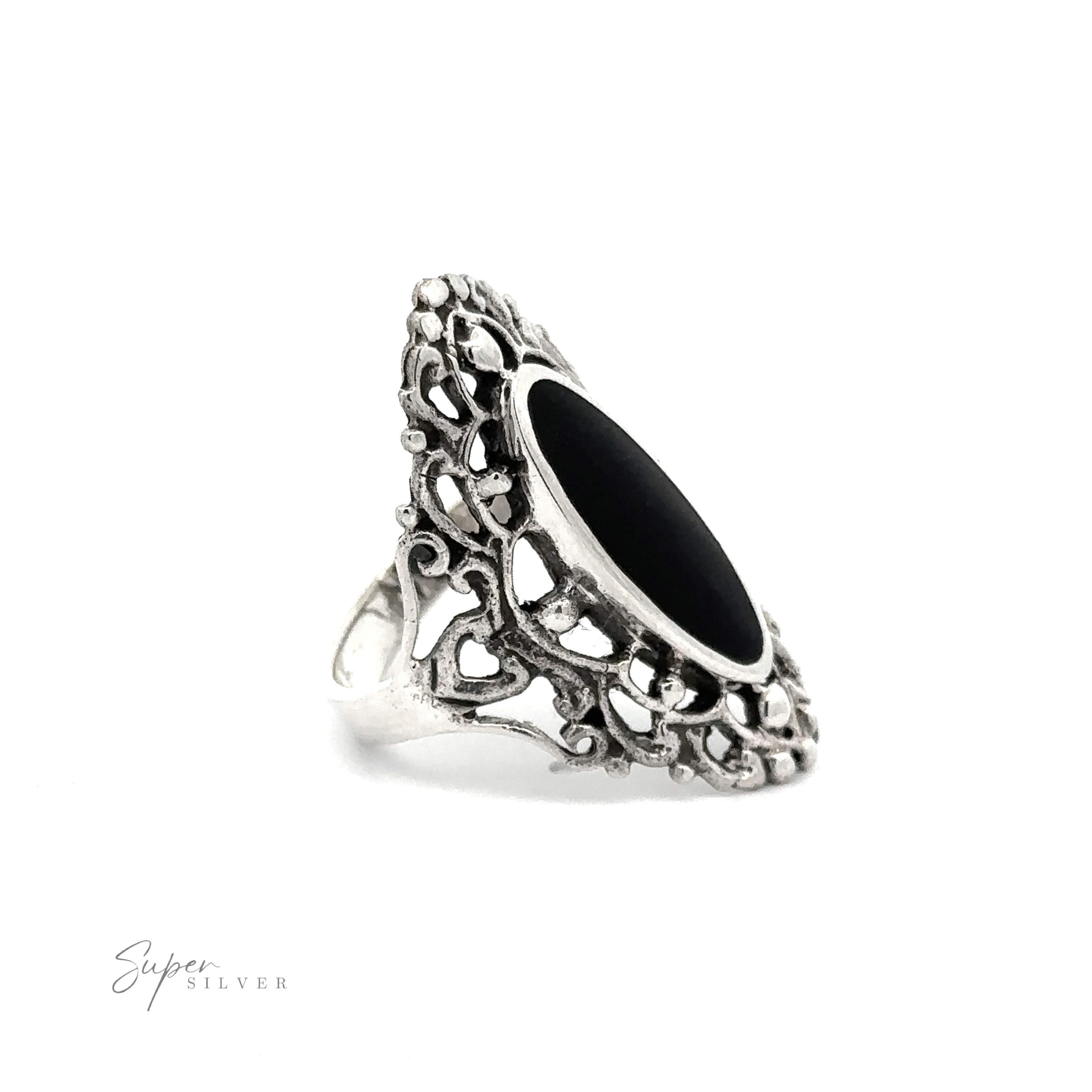 An ornate silver Filigree Shield Ring with Inlaid Stones.