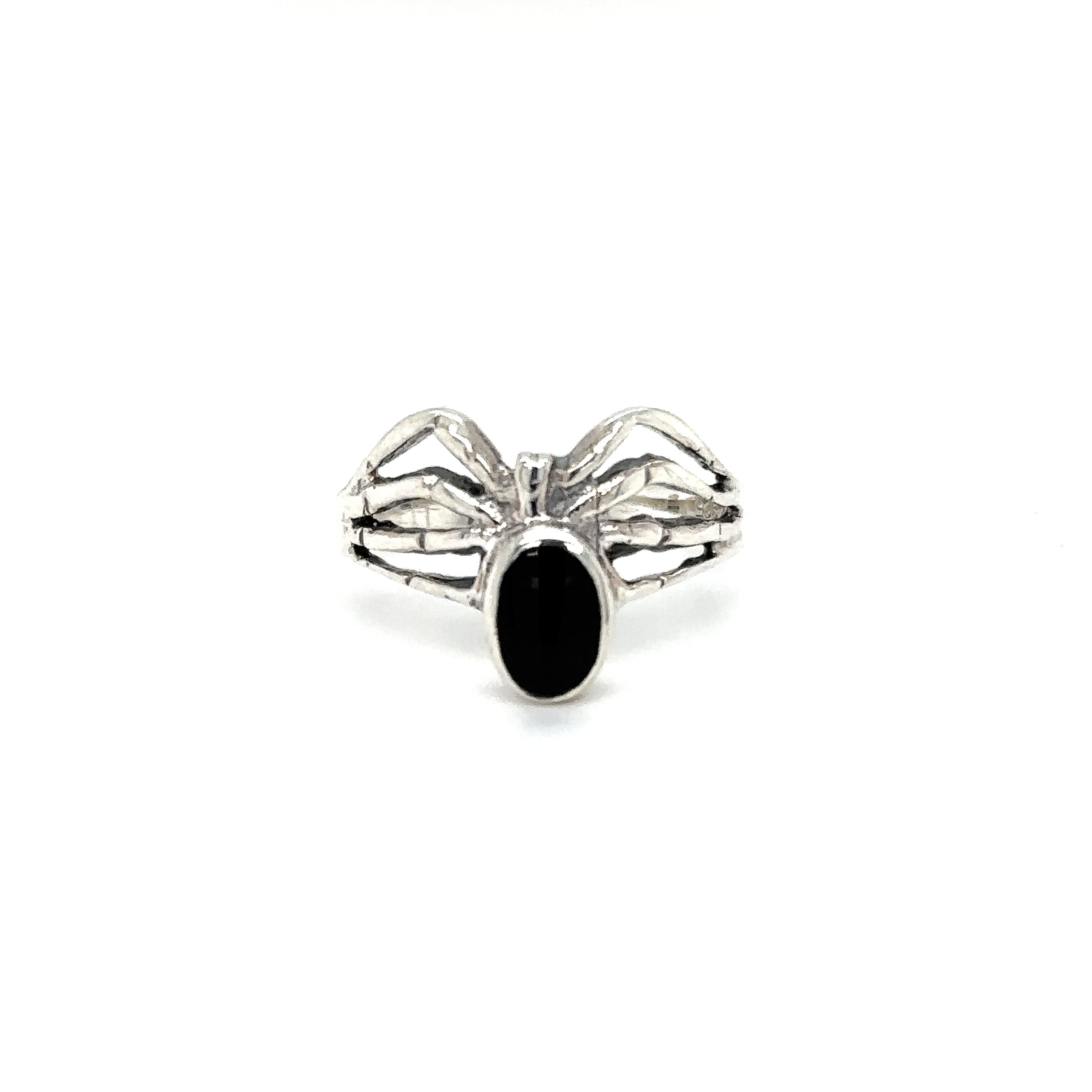 A Super Silver Inlay Stone Spider Ring with a black stone in the middle.