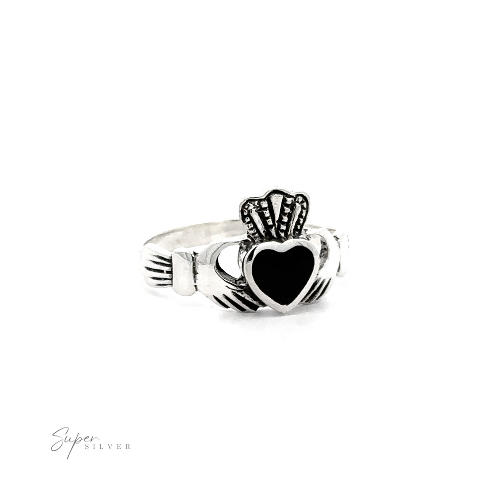 
                  
                    Claddagh Inlaid Stone ring featuring a heart and crown design, symbolizing Irish heritage, isolated on a white background with a subtle logo at the bottom.
                  
                