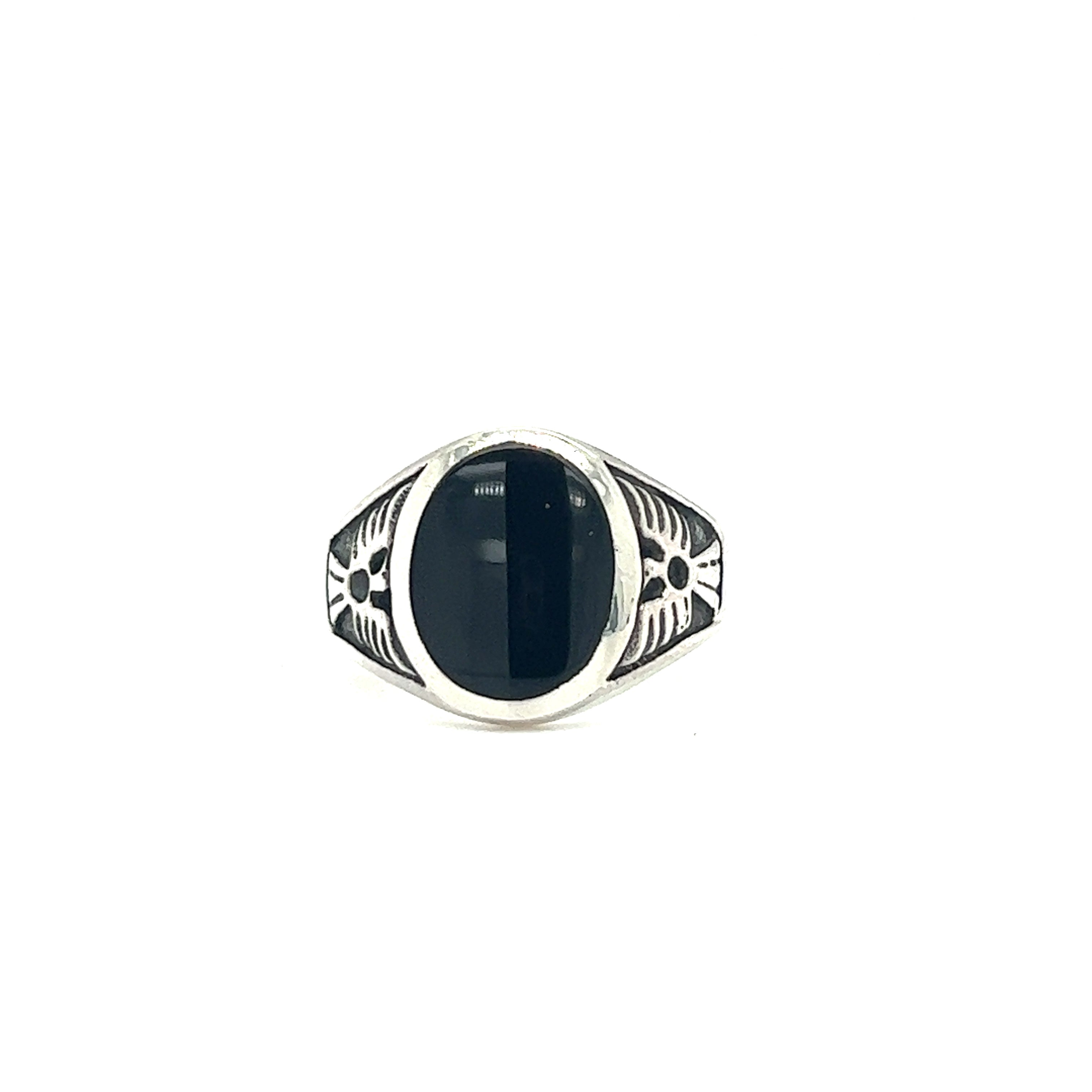 A native inspired sterling silver Oval Onyx Ring With Thunderbird Design adorned with a black onyx stone.