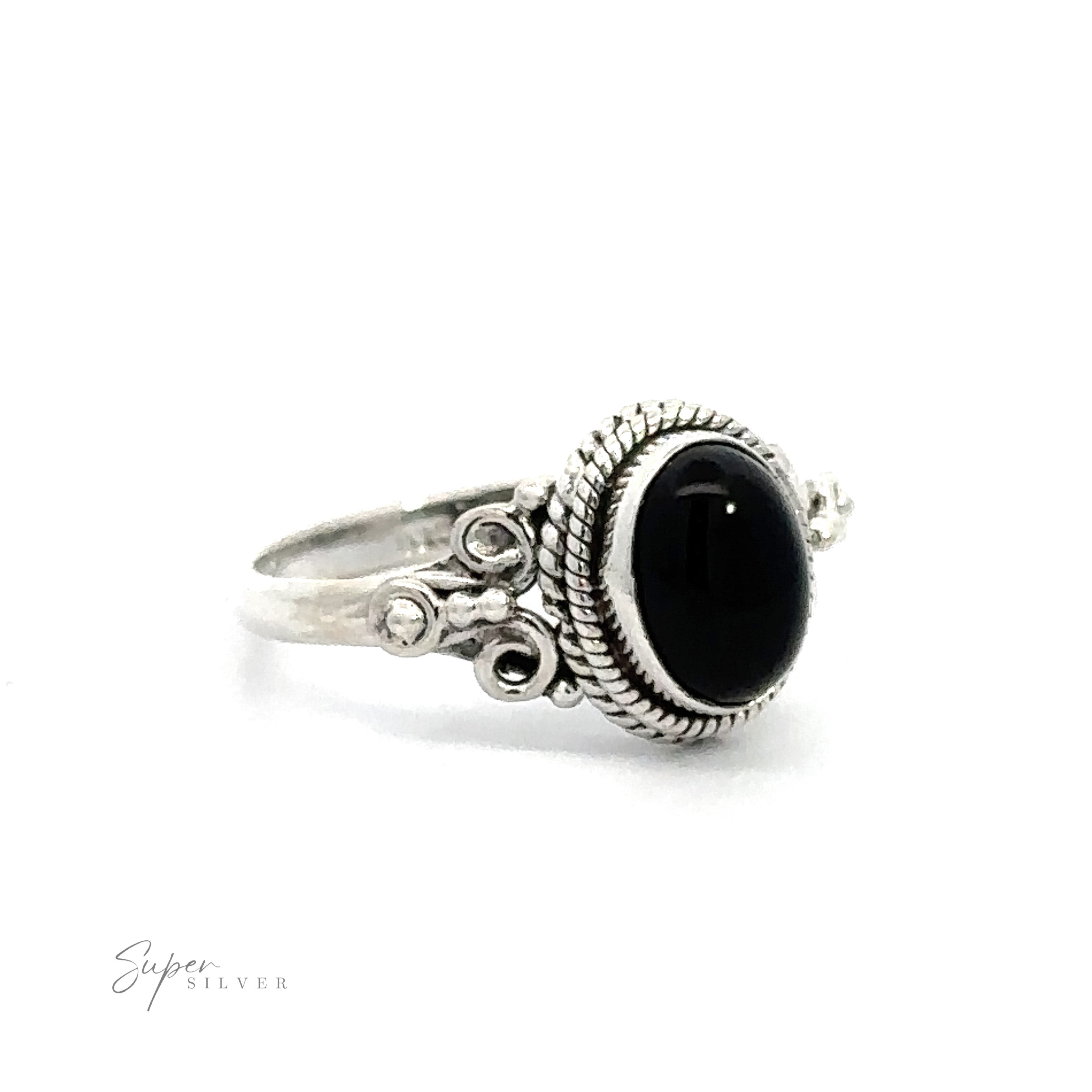 Natural Oval Gemstone Ring with Intricate Rope and Long Spiral Border with a black stone centerpiece and detailed metalwork, classified as vintage boho jewelry.