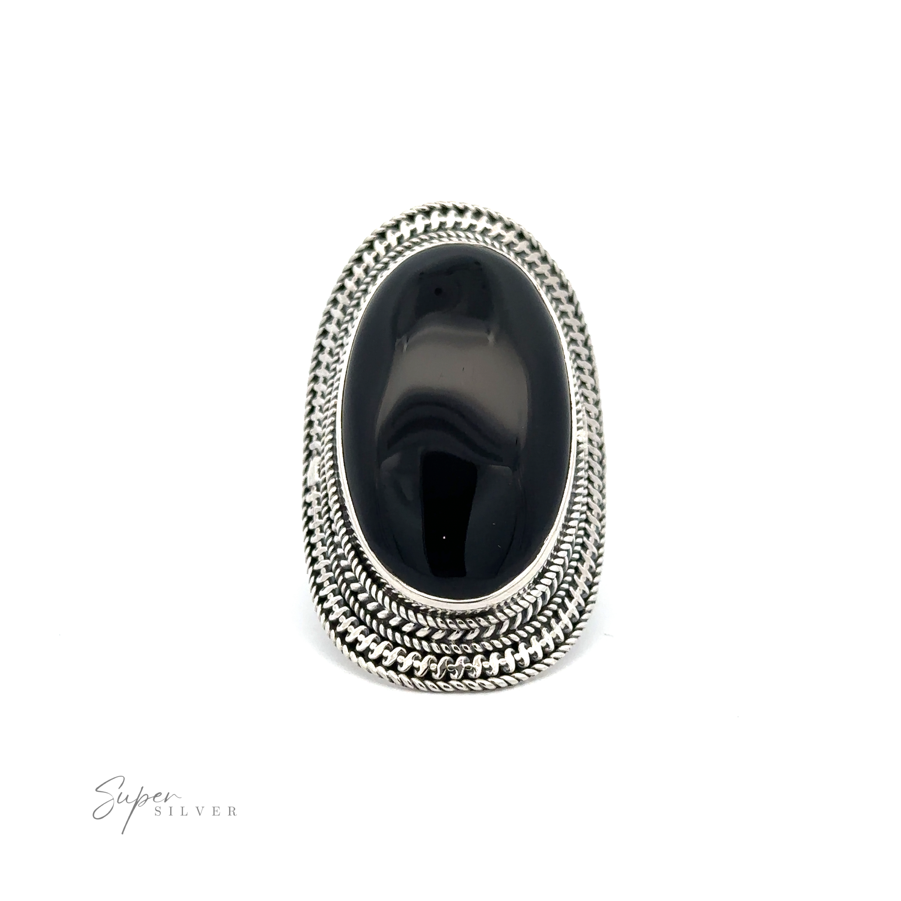 An **Large Oval Shield Gemstone Ring** set in a silver ring with intricate detailing, displayed against a plain white background, exudes a touch of bohemian flair.