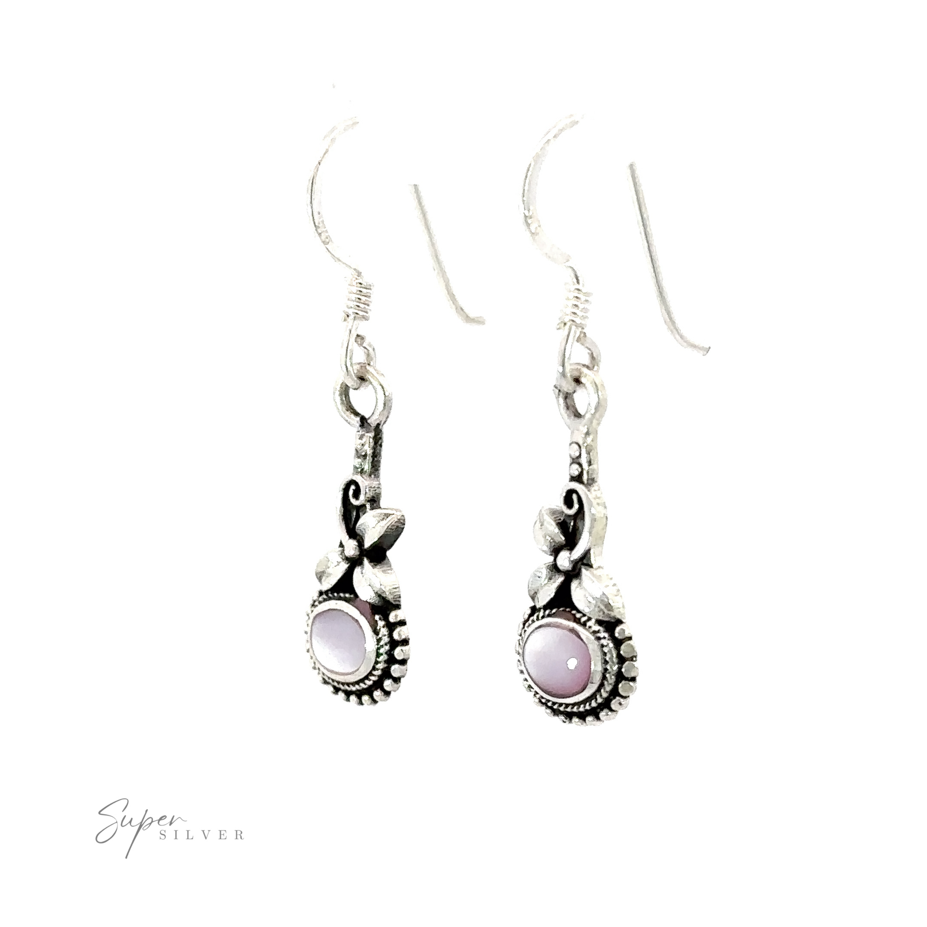 A pair of Inlaid Flower Earrings with Oval Stone, adding a touch of boho elegance.