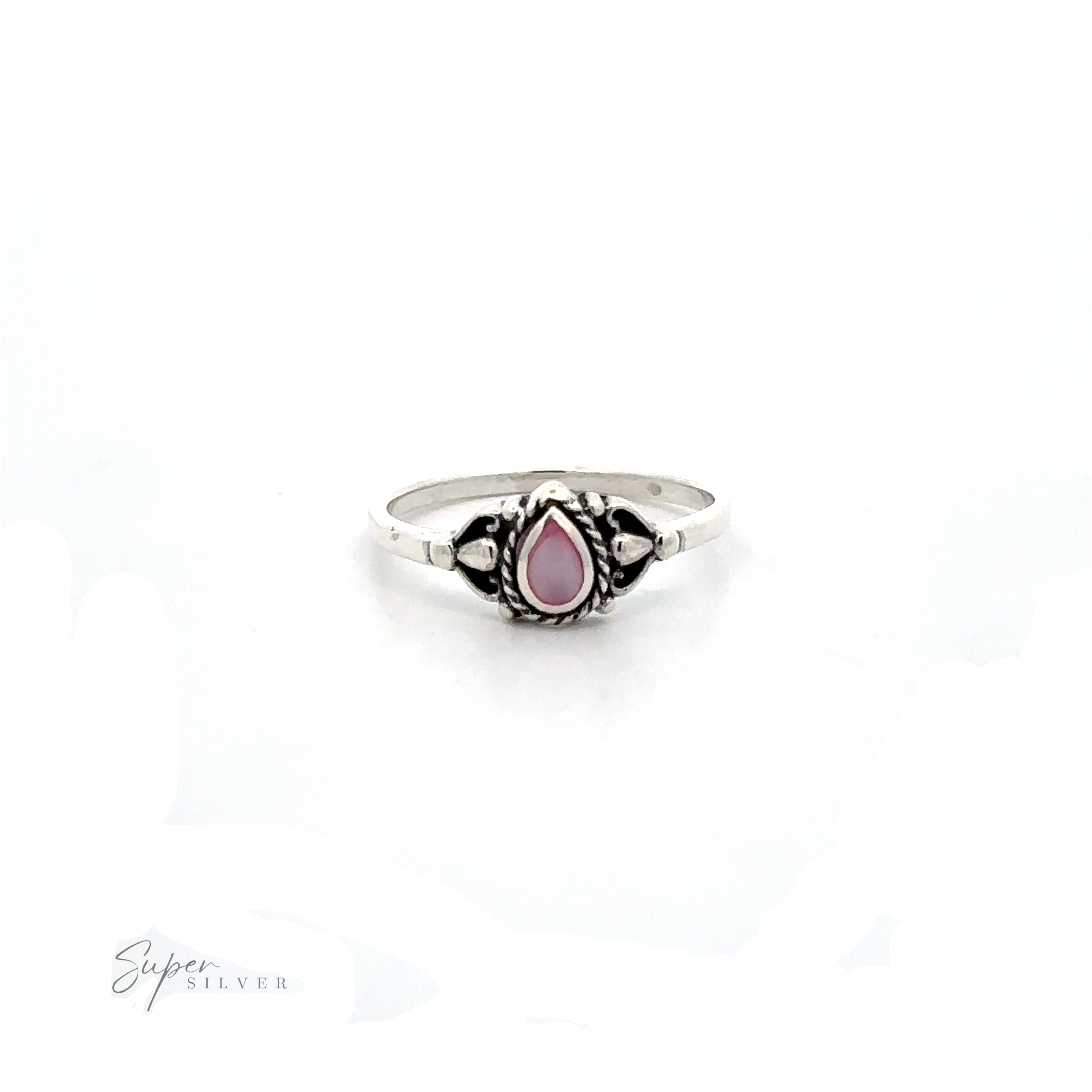 A Delicate Teardrop Inlay Stone Ring with Vintage Look with a pink stone.