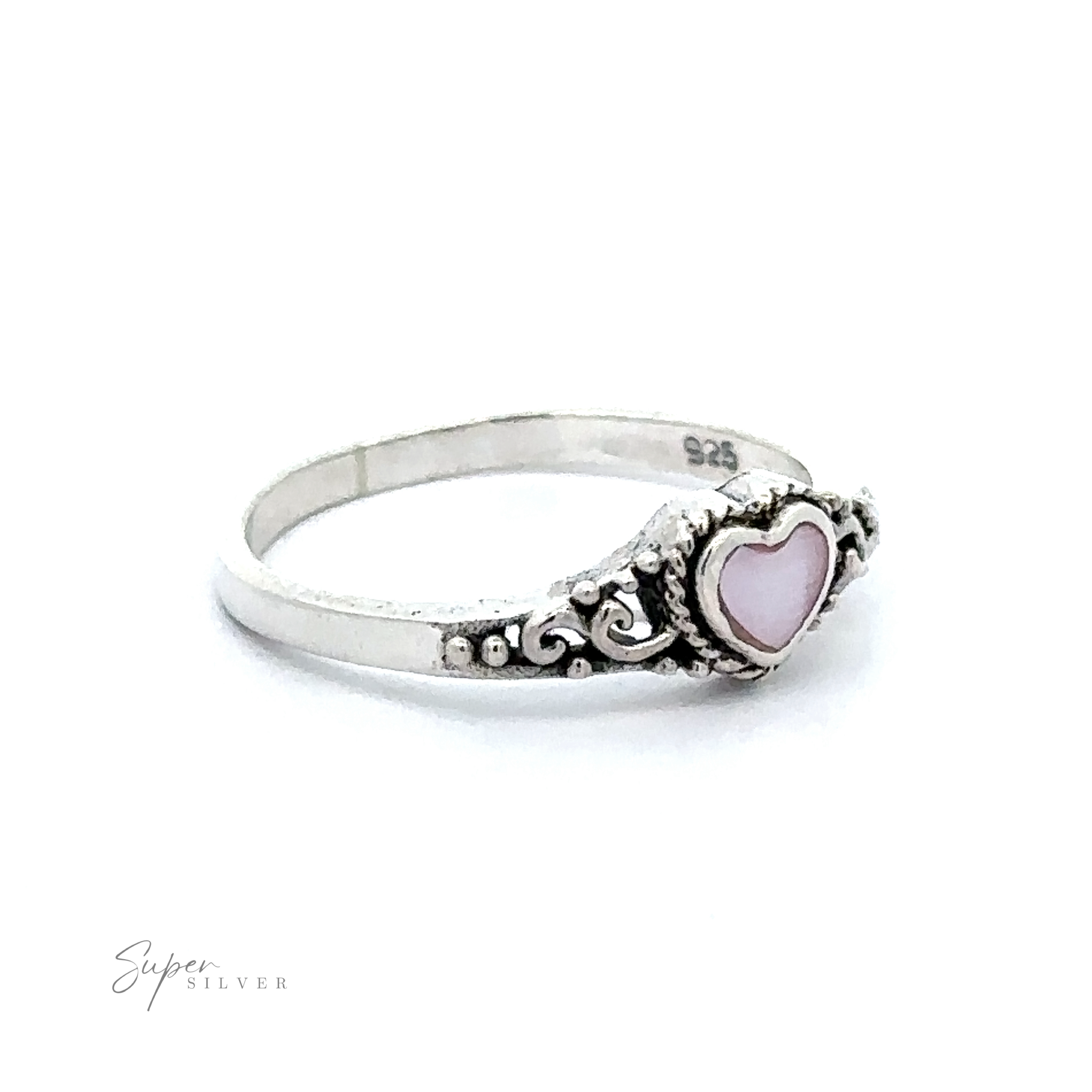 A Dainty Heart Filigree Ring with Inlaid Stones with a pink heart-shaped mother-of-pearl stone.