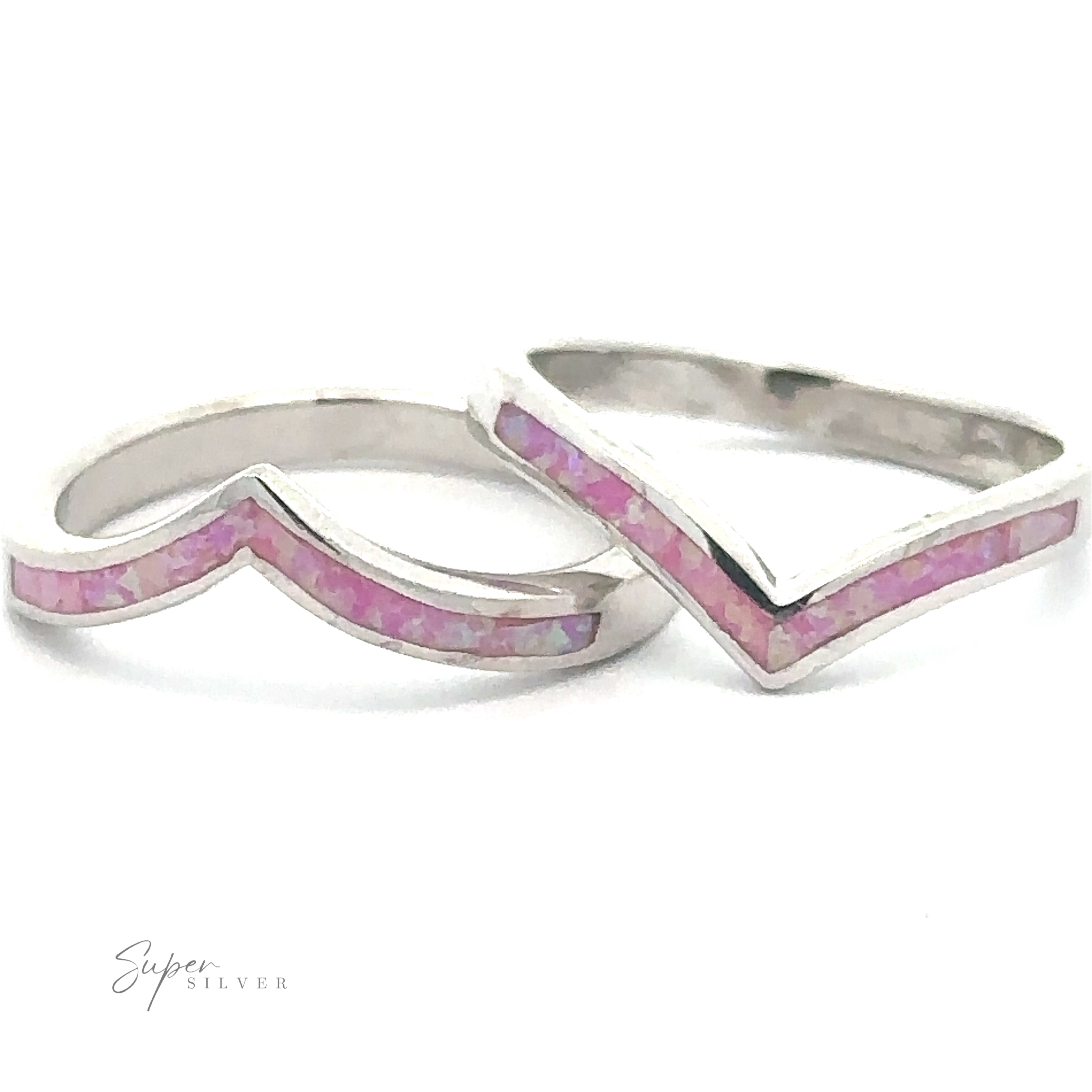 Two Elegant Chevron Lab Opal Rings with pink inlay arranged to form the shape of a heart.