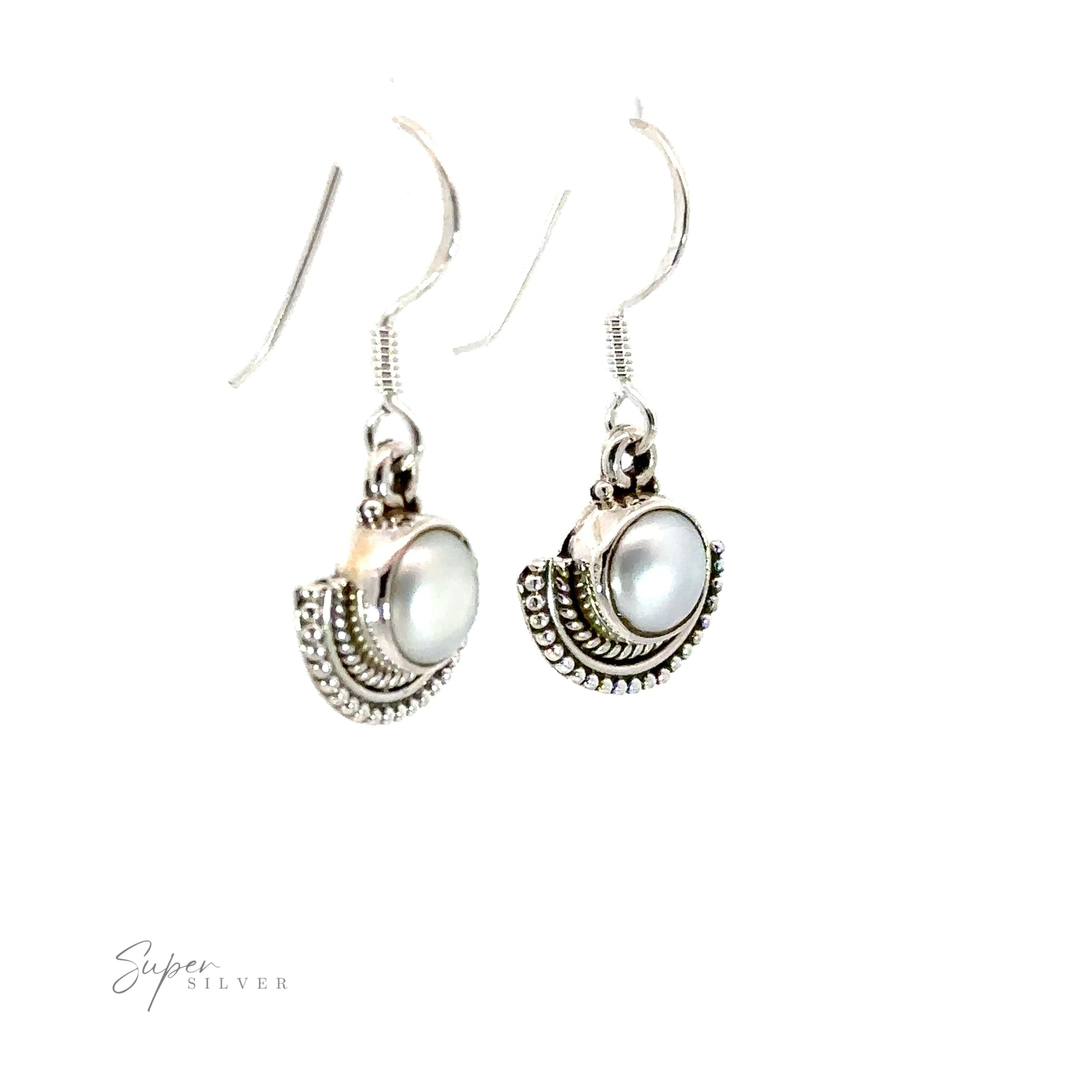 A pair of Round Gemstone Earrings with Fan Setting, featuring white pearls and a rustic silver fan-like setting.