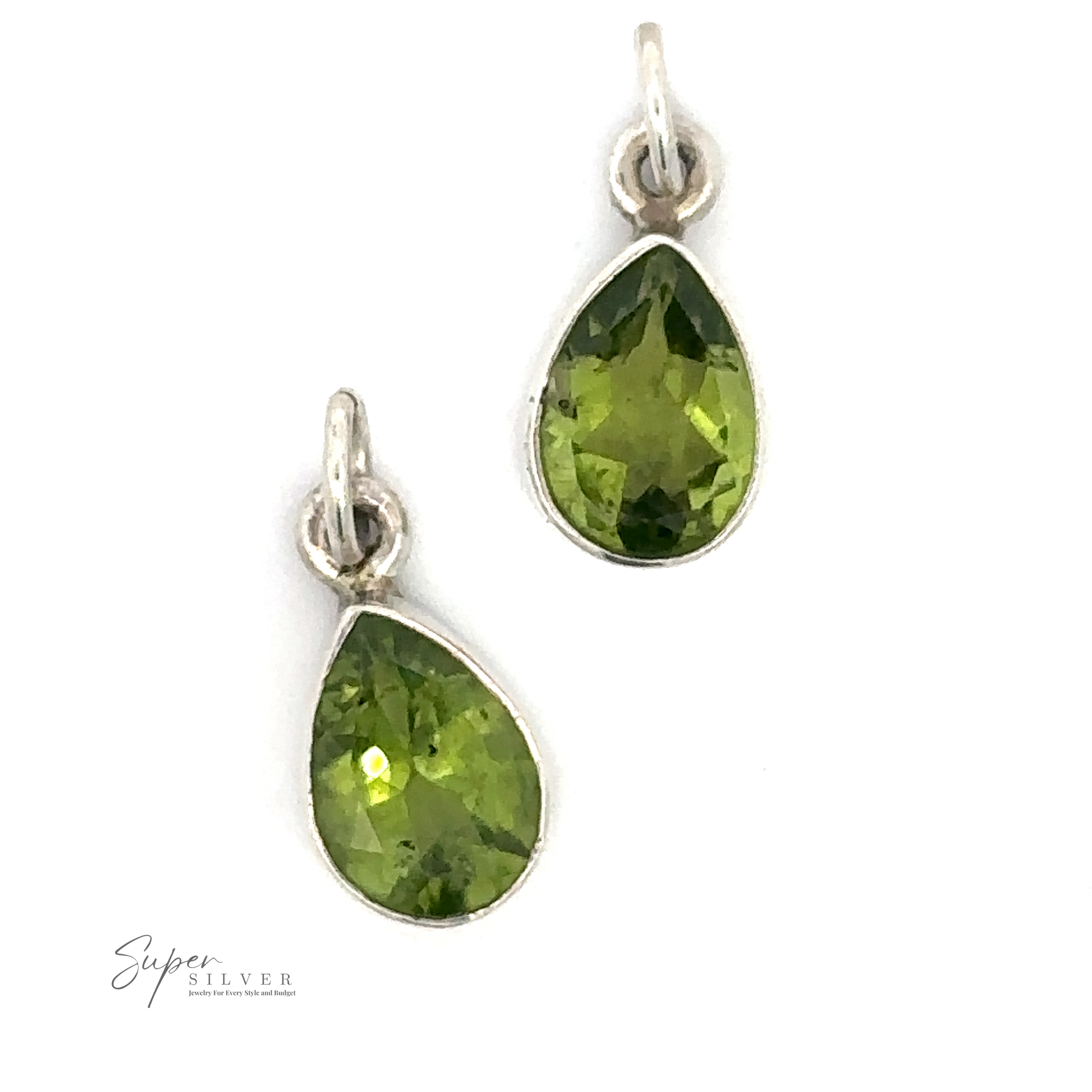 A pair of sterling silver drop earrings with teardrop-shaped green gemstones, resembling a simple Peridot Teardrop Pendant, set against a white background.