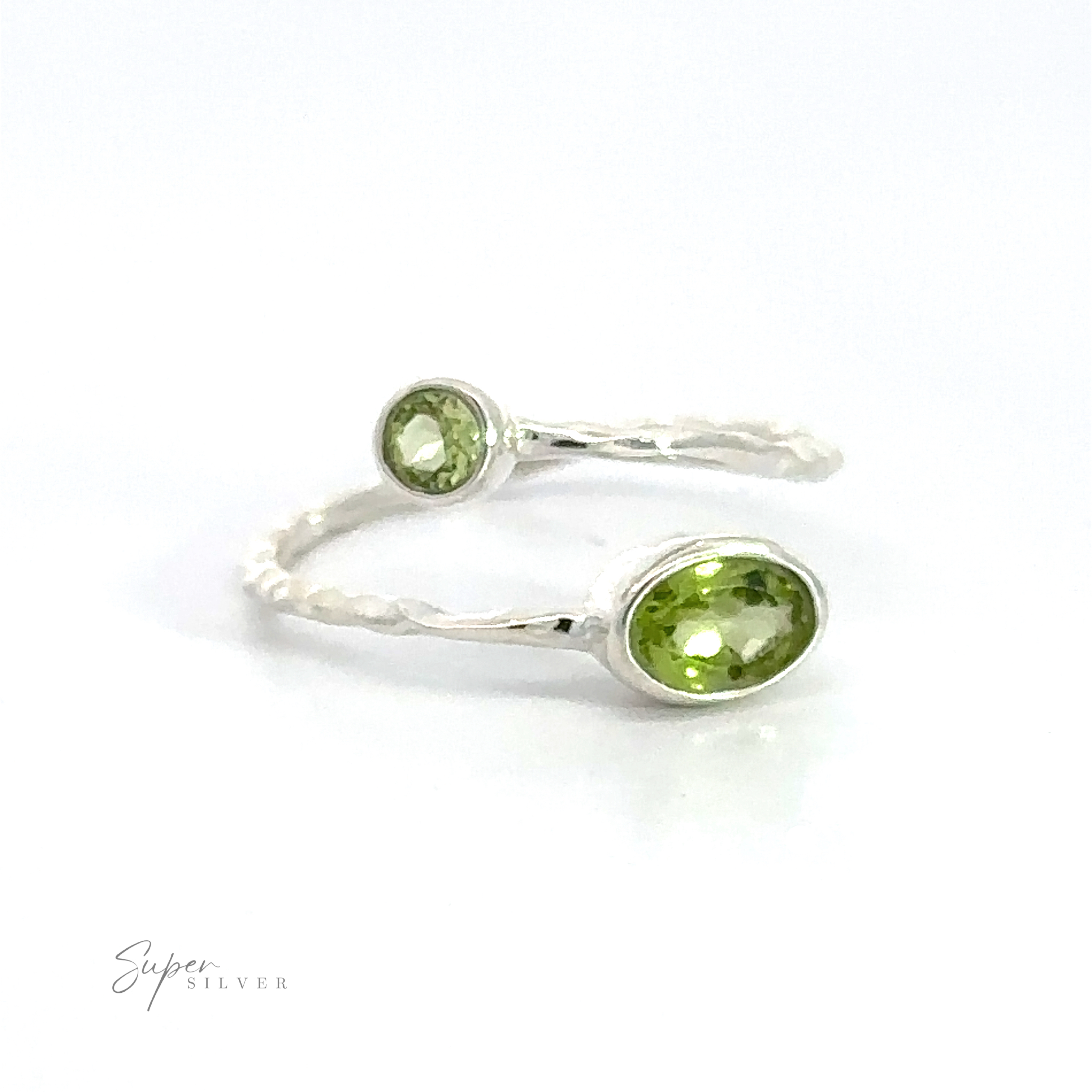 A pair of Textured Adjustable Bands with Adorned Green Gemstones on a white background.
