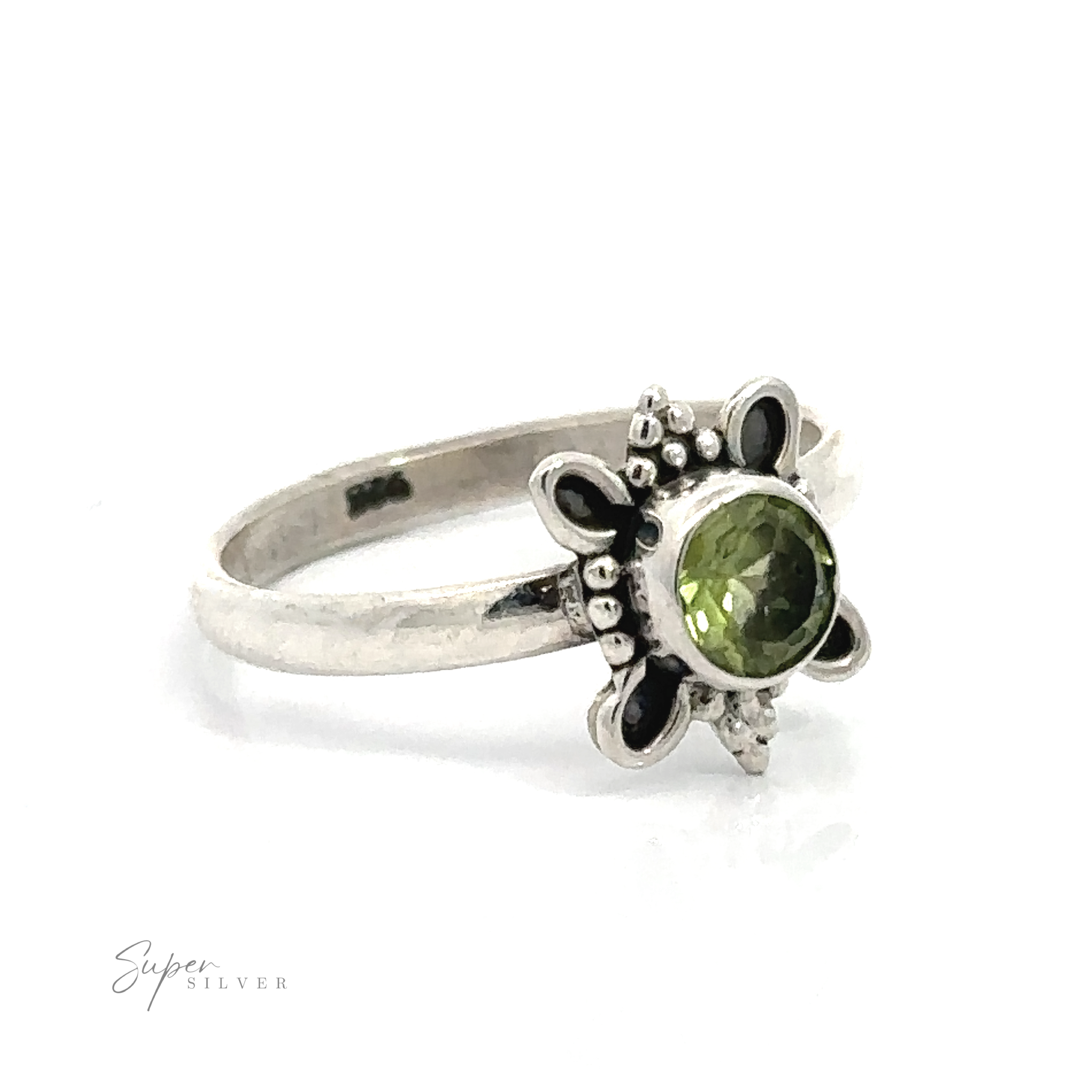 Round Faceted Gemstone Ring with Ball and Loop Design with a green gemstone centerpiece and floral detailing on the band.