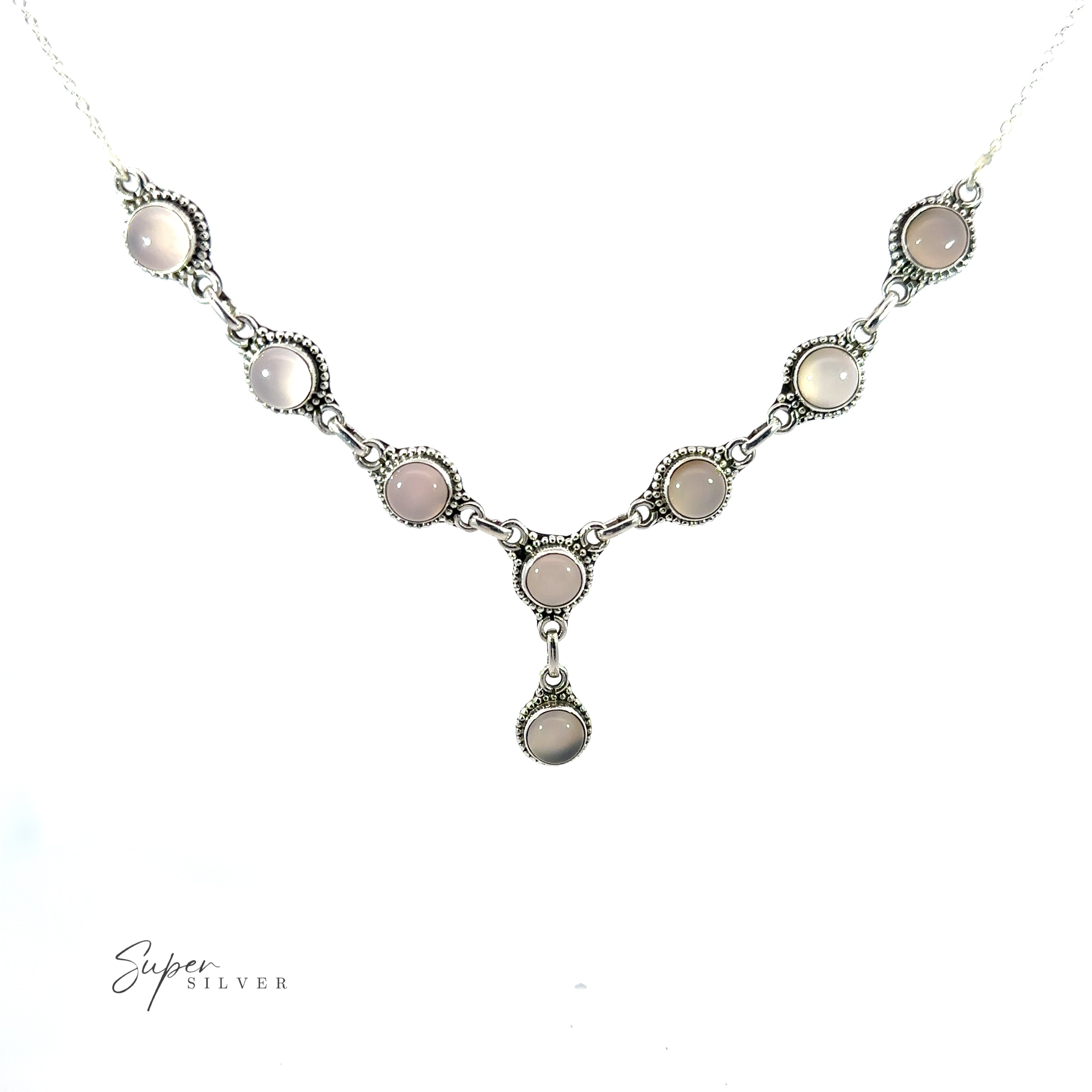 A Round Gemstone Y Necklace with Ball Border with eight round, light-colored stones in a linked pattern. This bohemian style jewelry piece features a single dangling stone at the center, and the text "Super Silver" is visible in the lower-left corner.