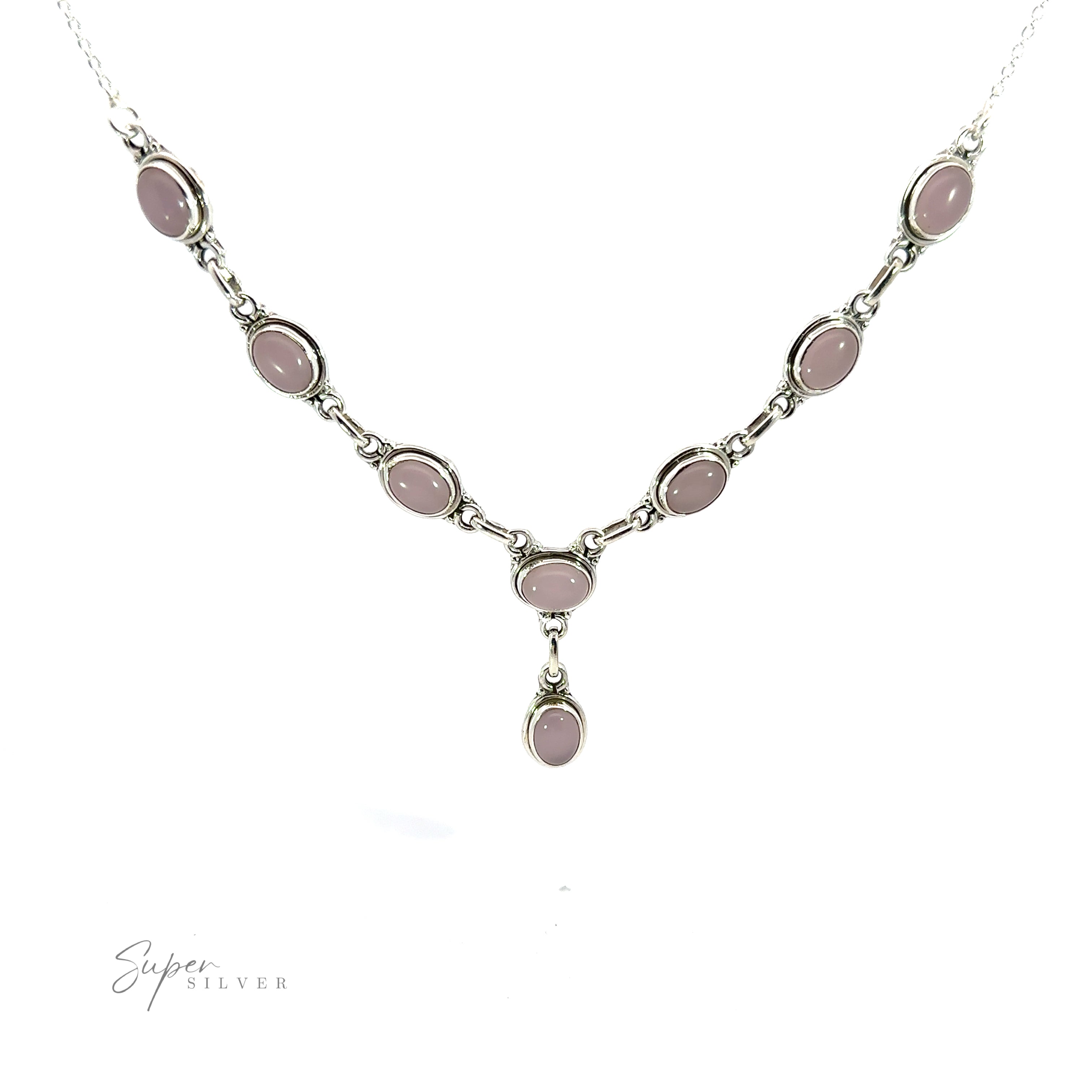 A Simple Oval Y Necklace with Gemstones featuring oval-shaped pink gemstones, with a single dangling pink gemstone at the center. The necklace exudes bohemian charm and is displayed on a plain white background.