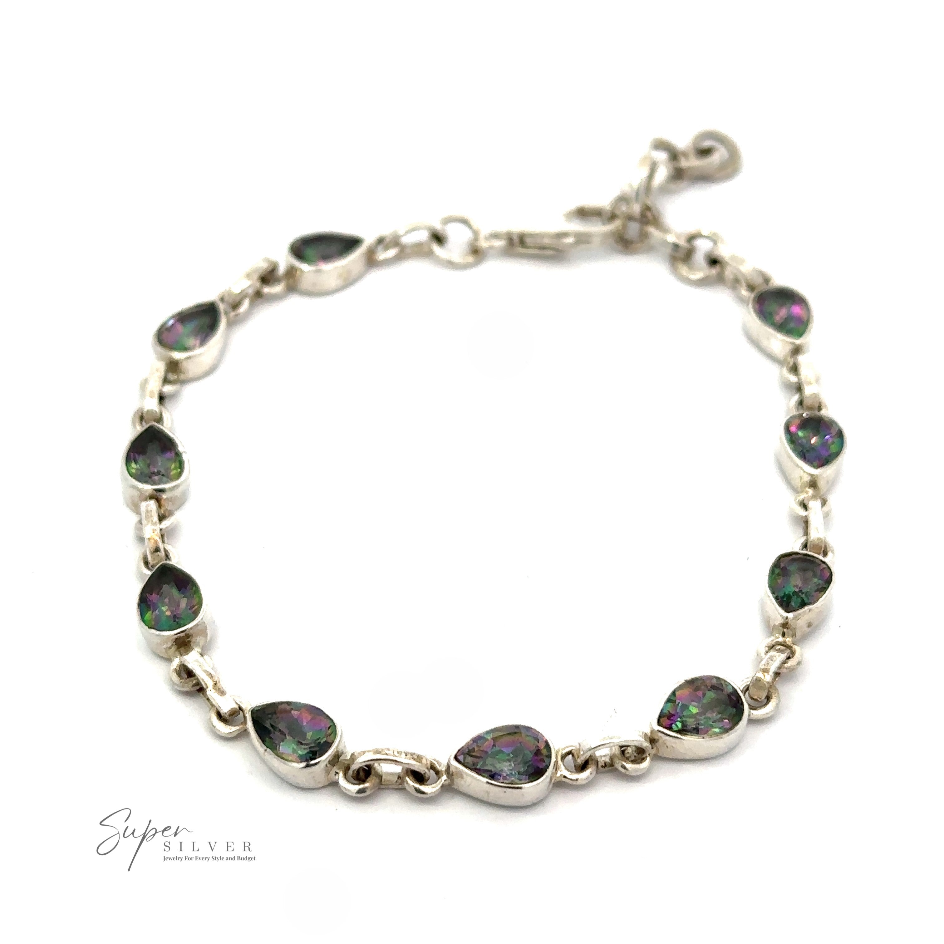 The Rainbow Mystic Topaz Teardrop Shape Link Bracelet features teardrop-shaped green and purple iridescent stones set in a silver chain with a clasp and adjustable chain extender. The "Super Silver" logo is visible in the lower left corner, marking this piece as a true Rainbow Mystic Topaz Teardrop Shape Link Bracelet treasure.