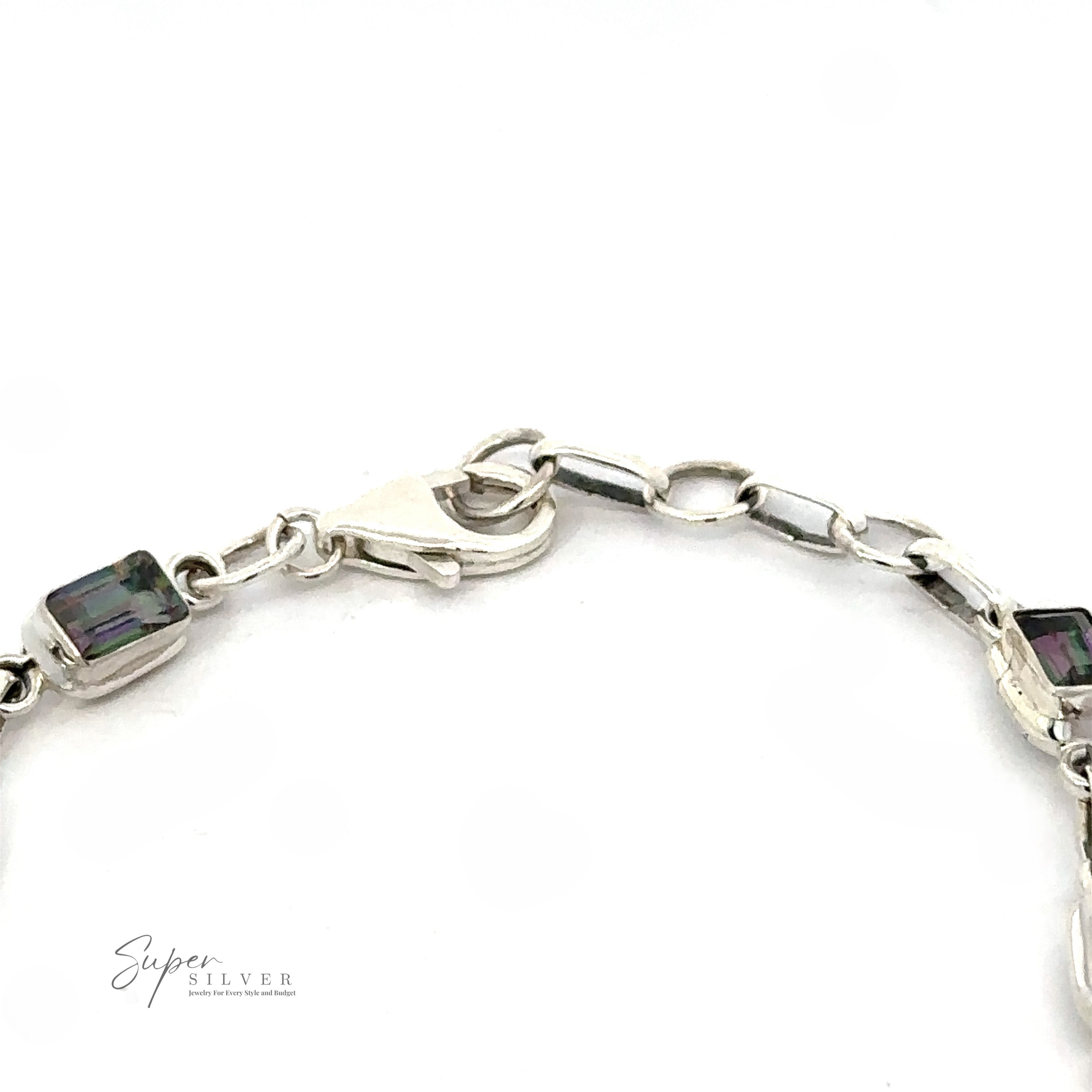 A close-up image of a Rainbow Mystic Topaz Rectangle Link Bracelet featuring a clasp and rectangular gemstones. The image includes the "Super Silver" logo in the bottom left corner.