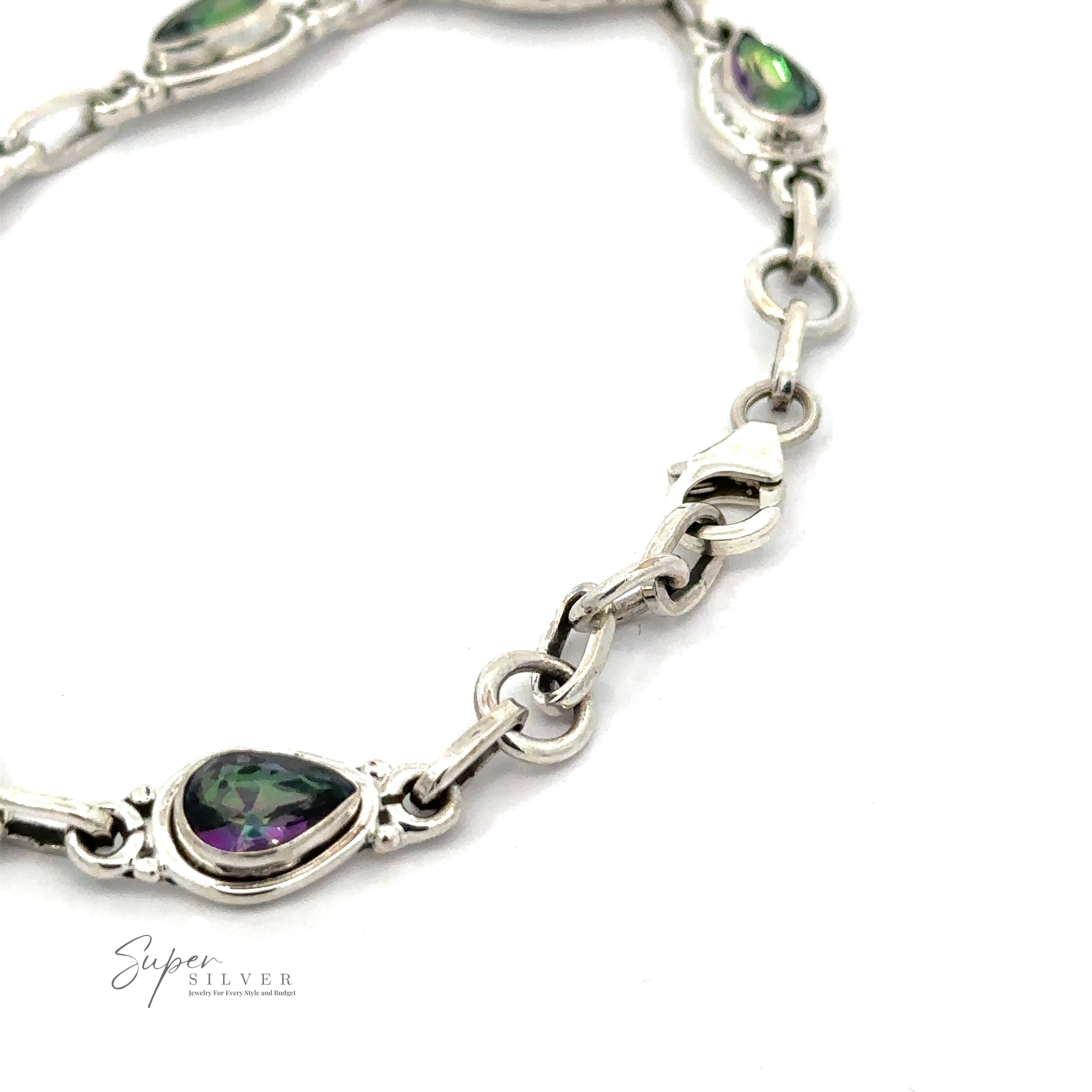 A close-up of a sterling silver bracelet with oval-shaped, multicolored gemstones set in ornate links. The bracelet features a clasp for fastening. The text "Super Silver" is visible in the corner, highlighting this exquisite Rainbow Topaz Bordered Teardrop Bracelet.