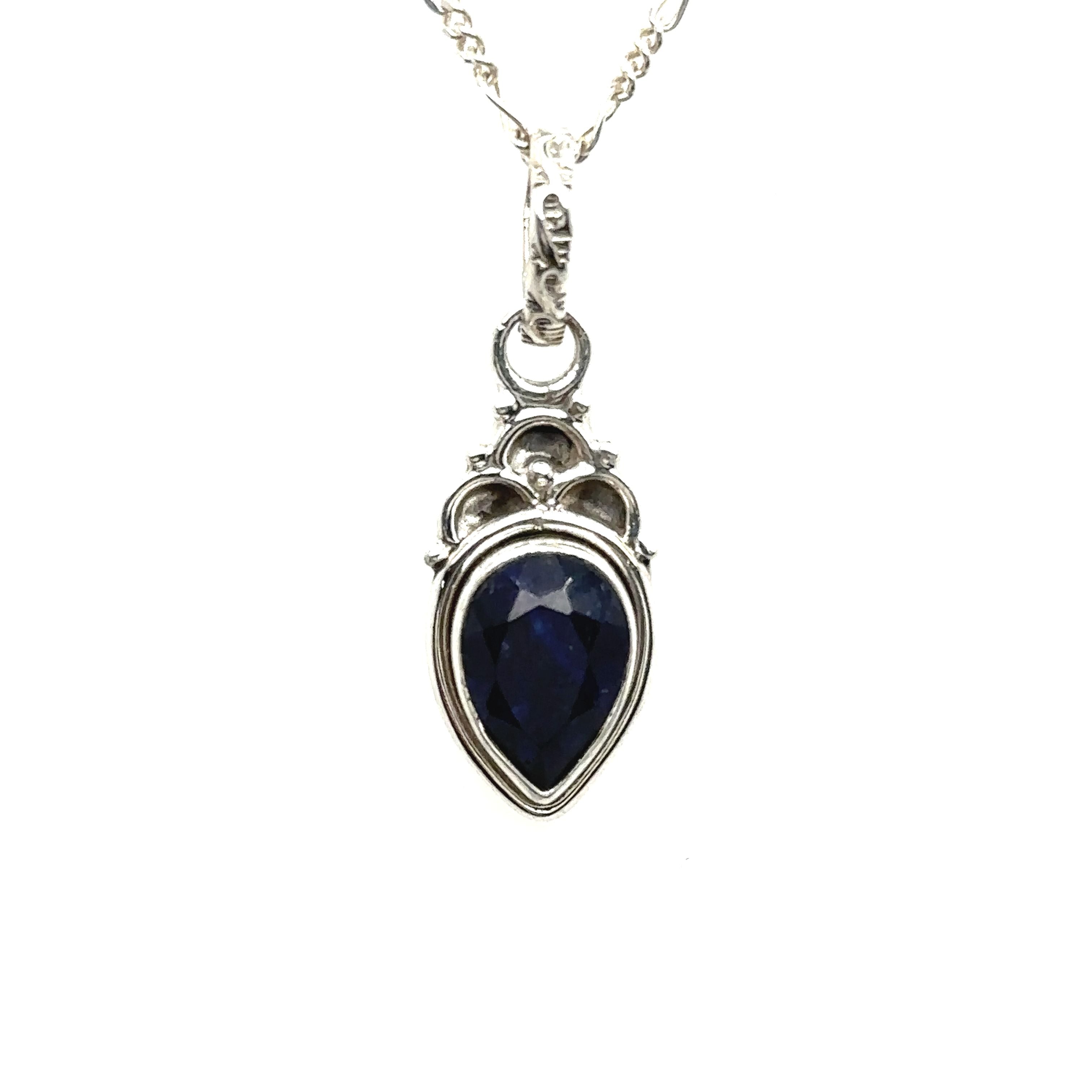 A Dainty Gemstone Teardrop Pendant with a blue sapphire, capturing the essence of free-spirited elegance in sterling silver.