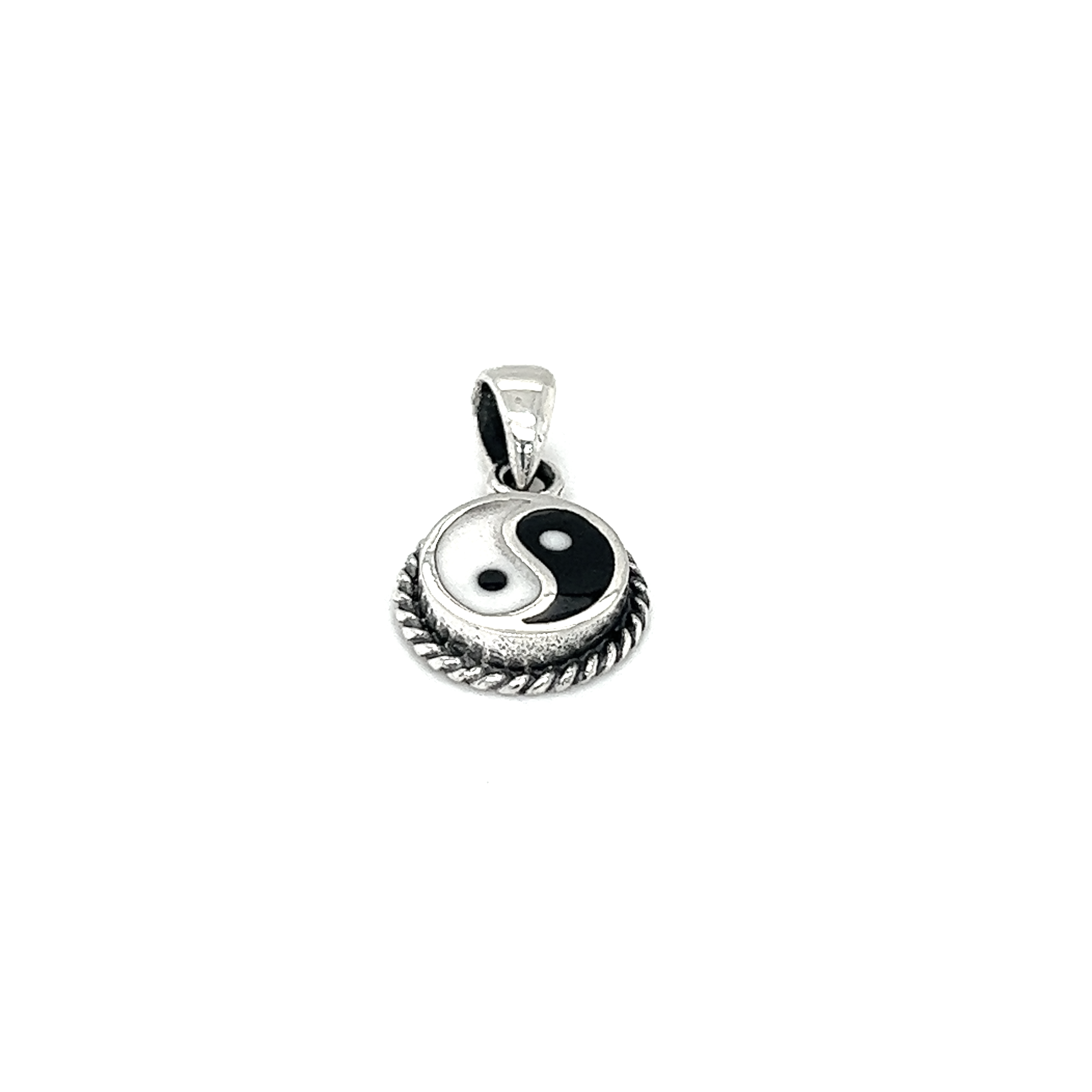 Various yin-yang pendants symbolizing balance on a white background.