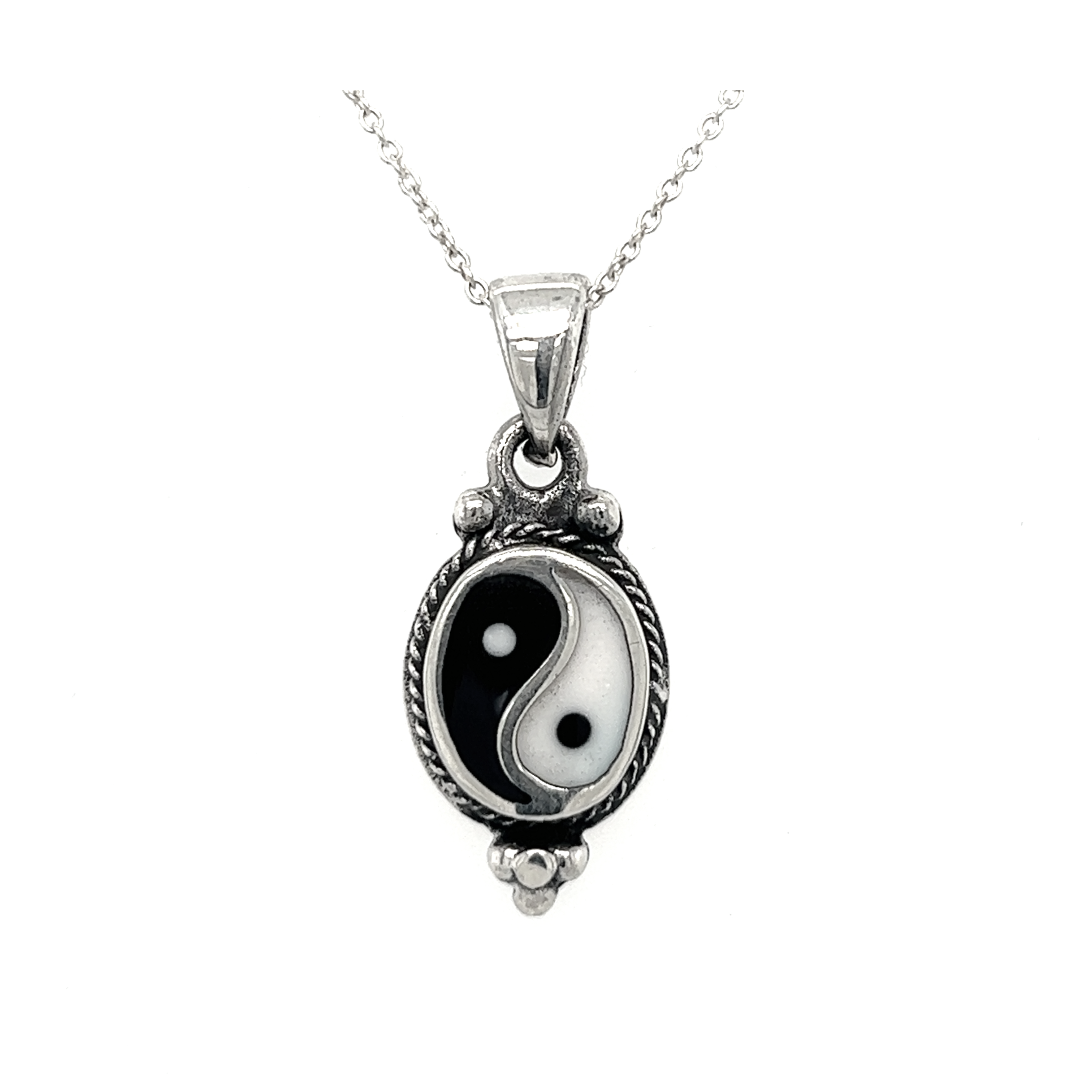 An interconnectedness symbol, the Various Yin-Yang Pendants, harmoniously combines white and black, representing balance, on a sleek silver chain.