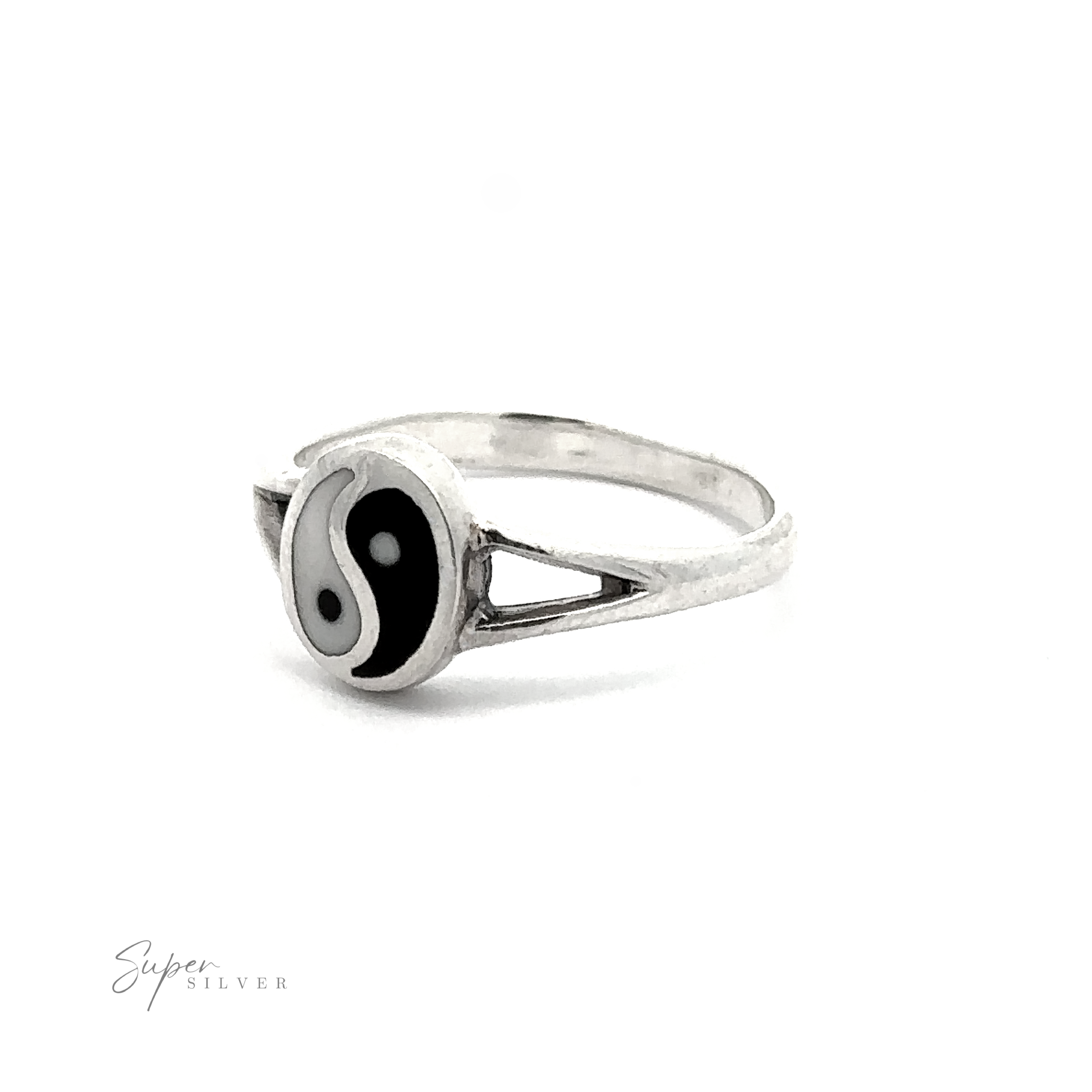 The Simple Inlaid Yin-Yang Ring is a minimalist sterling silver ring adorned with a black and white yin-yang symbol on its face and features triangular cutouts on either side of the band.
