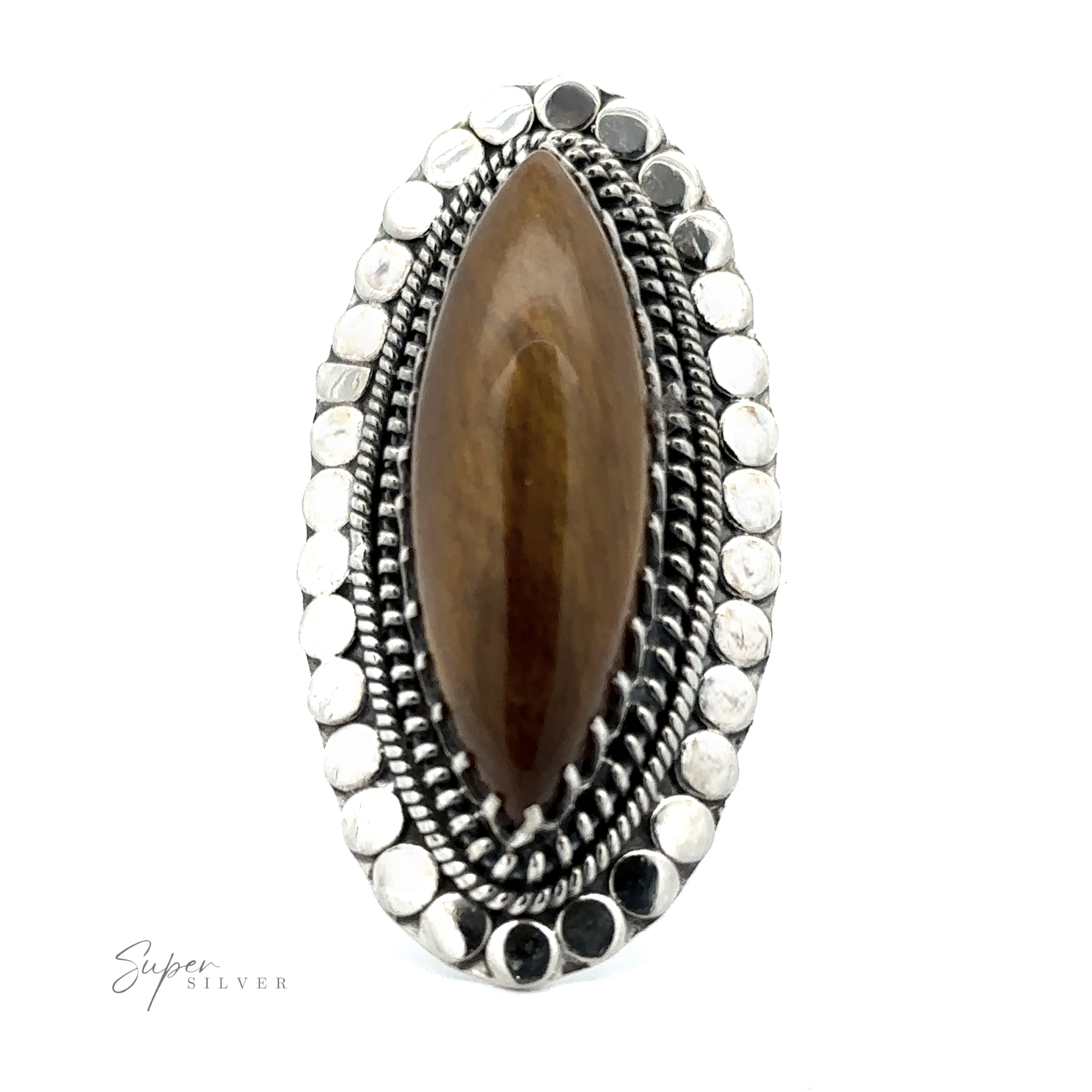 A close-up of a Statement Marquise Shaped Gemstone Ring featuring a brown marquise-shaped gemstone, encased in an ornate silver setting that boasts intricate details and circular patterns, epitomizing bohemian jewelry.