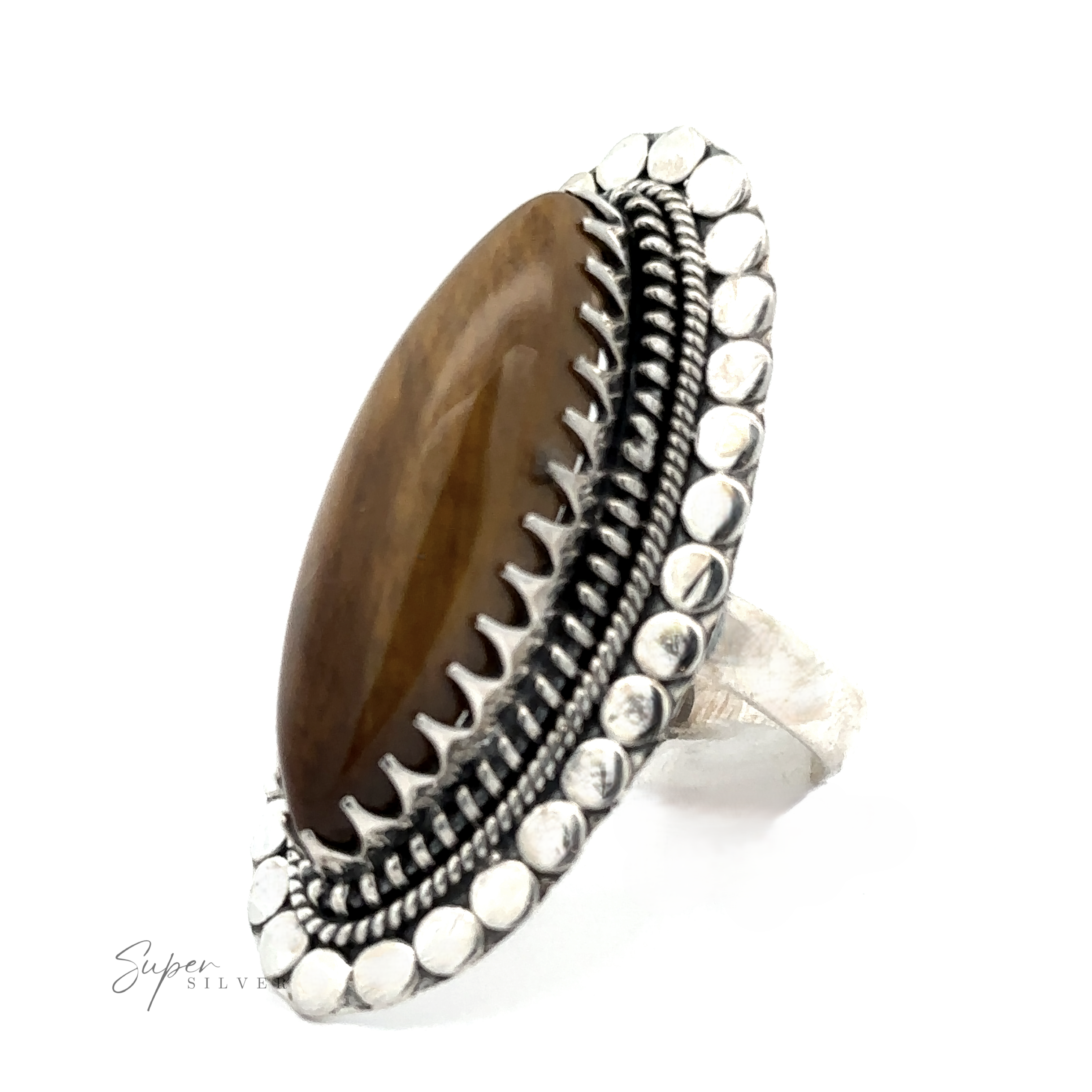 A silver ring featuring a large, oval brown gemstone with intricate beaded detailing around the edge. The band is also made of silver. The Statement Marquise Shaped Gemstone Ring adds a touch of elegance and uniqueness to any collection.