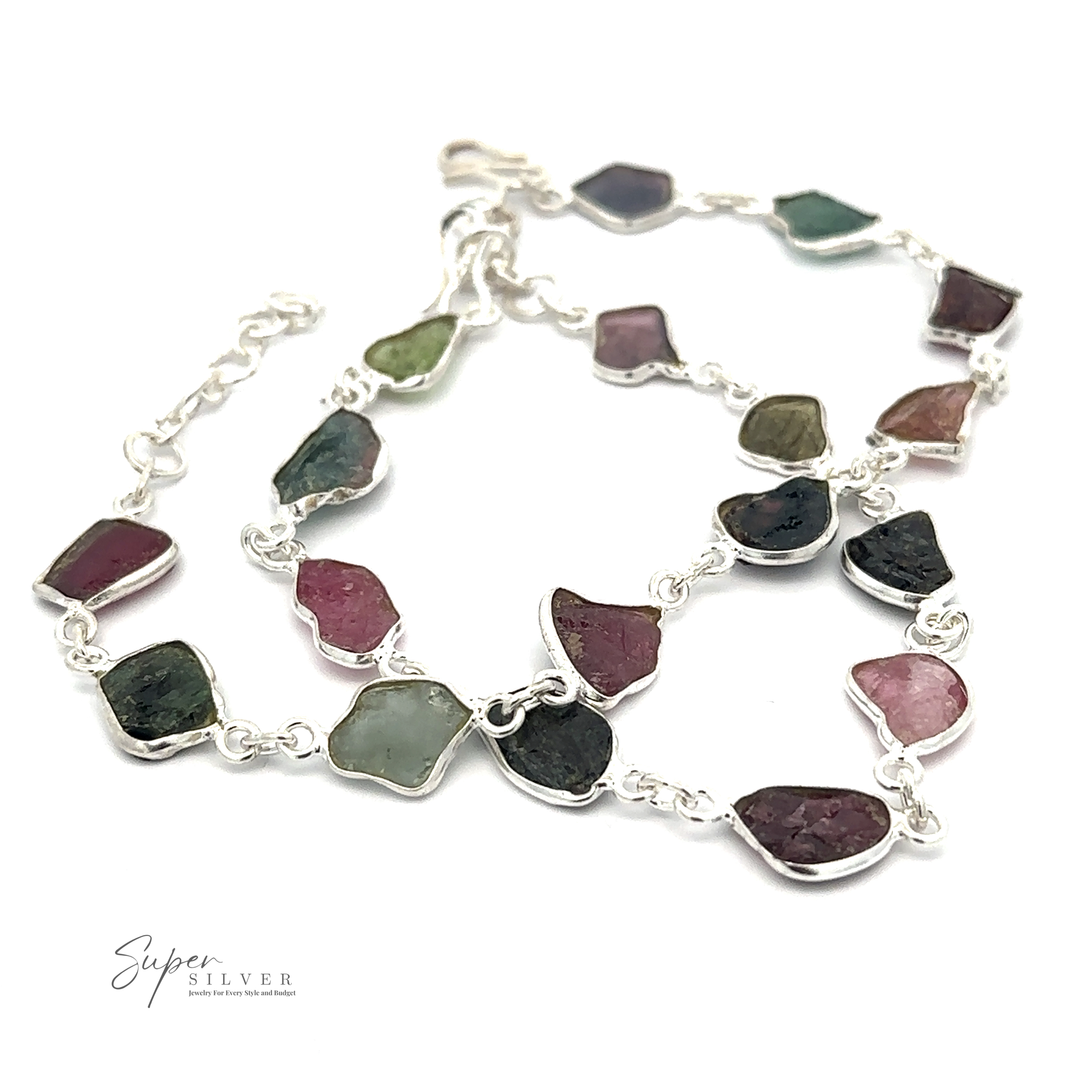 A Rough Tourmaline Bracelet featuring irregularly shaped, multicolored rough tourmaline stones, arranged in a linked chain design. The product exudes earthy elegance and is branded with "Super Silver" in the lower left corner.