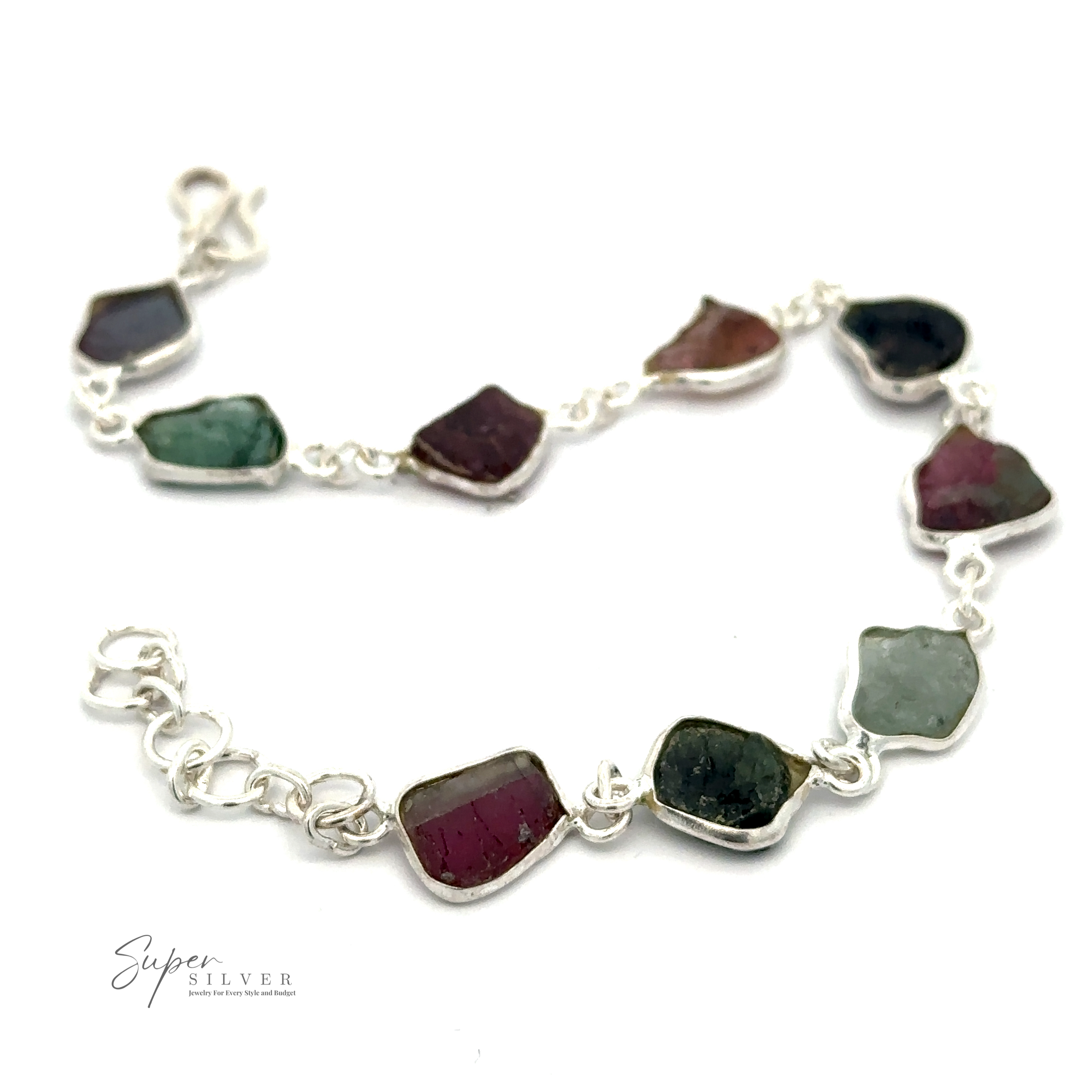 A Rough Tourmaline Bracelet displaying multiple irregularly shaped rough tourmaline stones, connected by links, with a branded logo "Super Silver" in the corner.