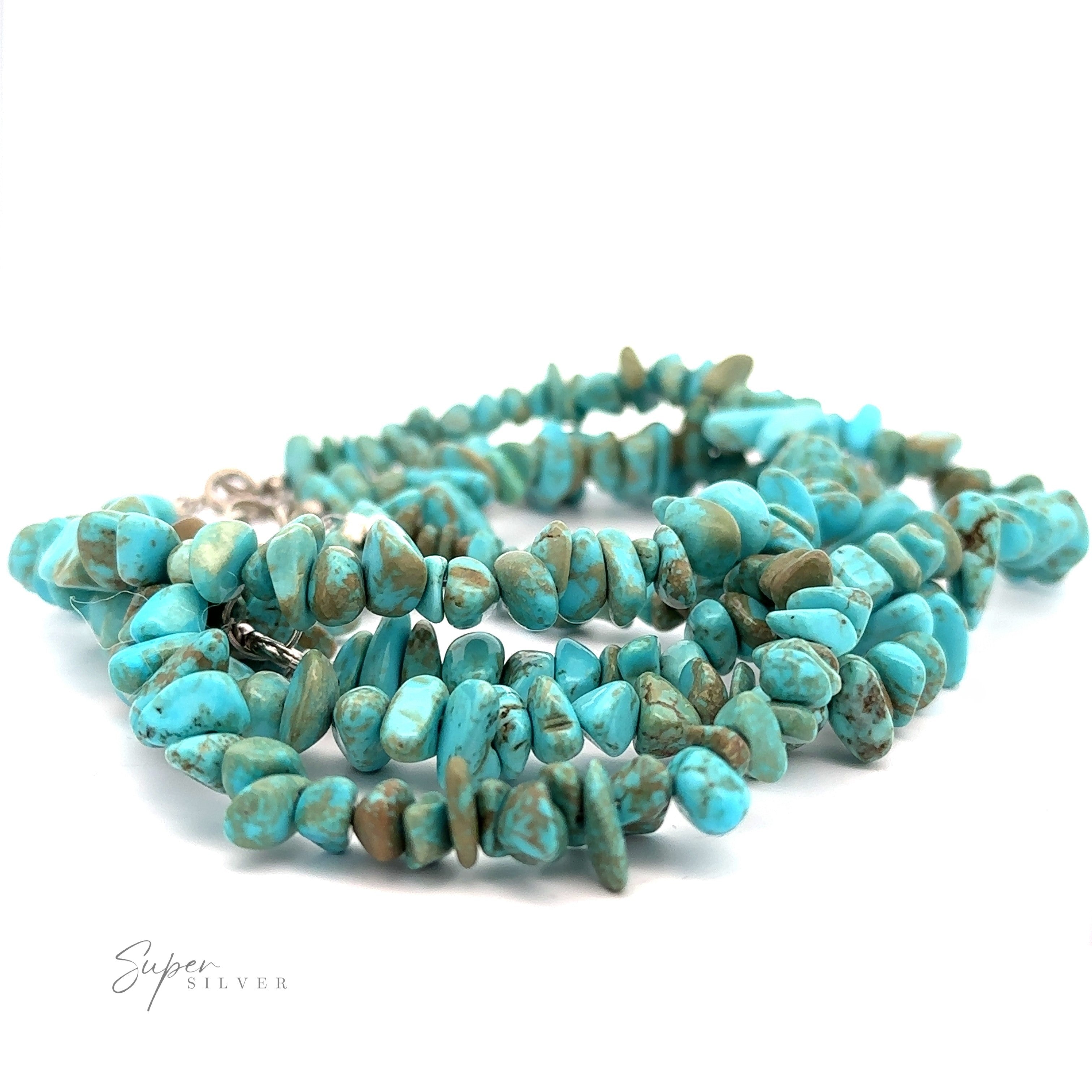 A Southwest Colorado Turquoise Chip Bracelet or Anklet is displayed against a white background. The beads, made of Colorado turquoise, are irregularly shaped and vary in shades of blue and green. A "Super Silver" logo is visible in the lower left corner, adding a touch of southwest charm to the piece.