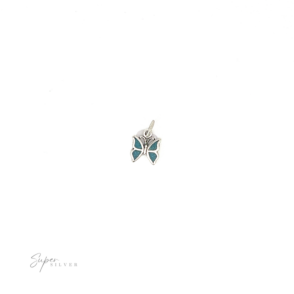 
                  
                    An understated Little Turquoise Butterfly Pendant adorned with turquoise stones.
                  
                