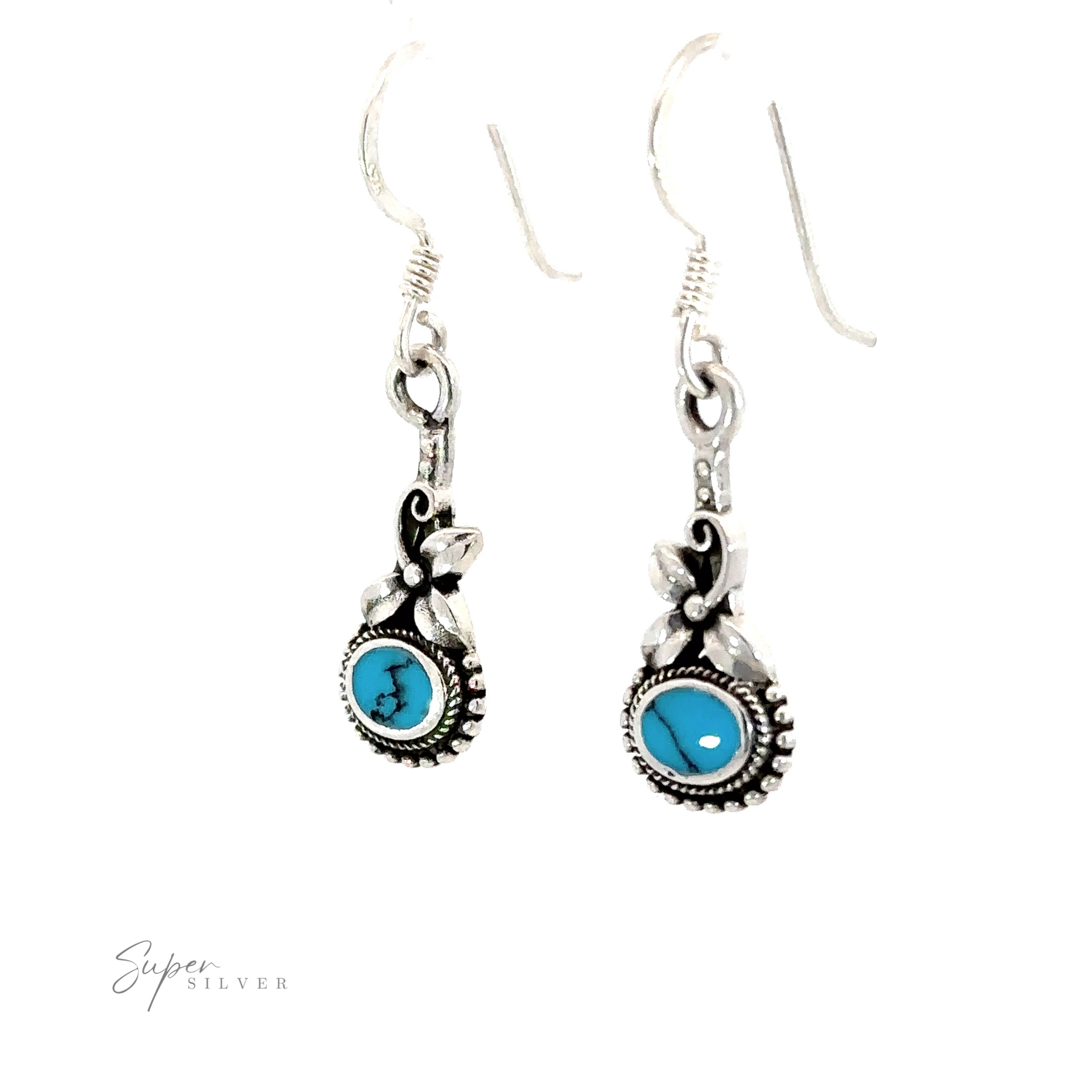 A pair of Inlaid Flower Earrings with Oval Stone, exuding Vintage Charm.