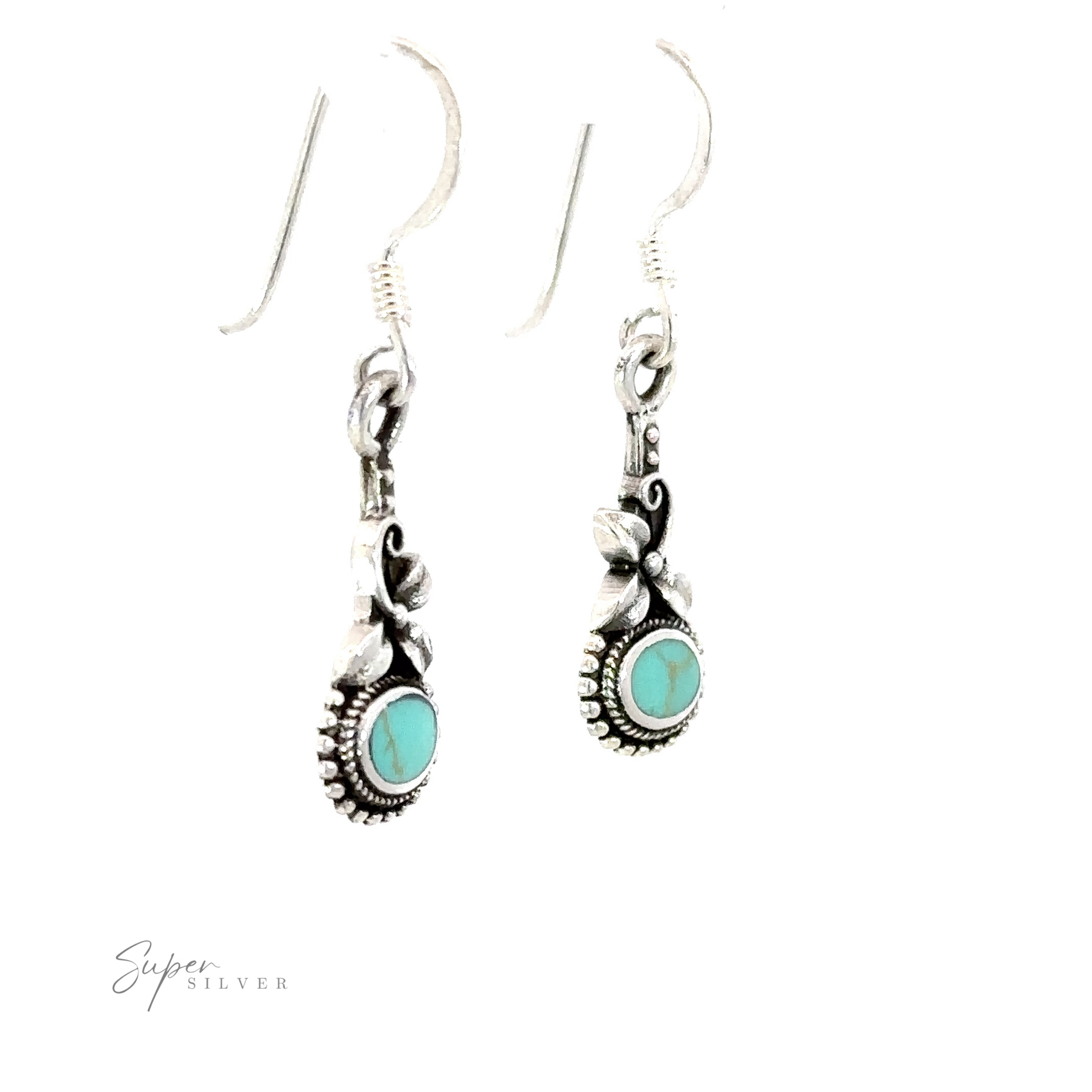 A pair of Inlaid Flower Earrings with Oval Stones, adding a touch of boho elegance.