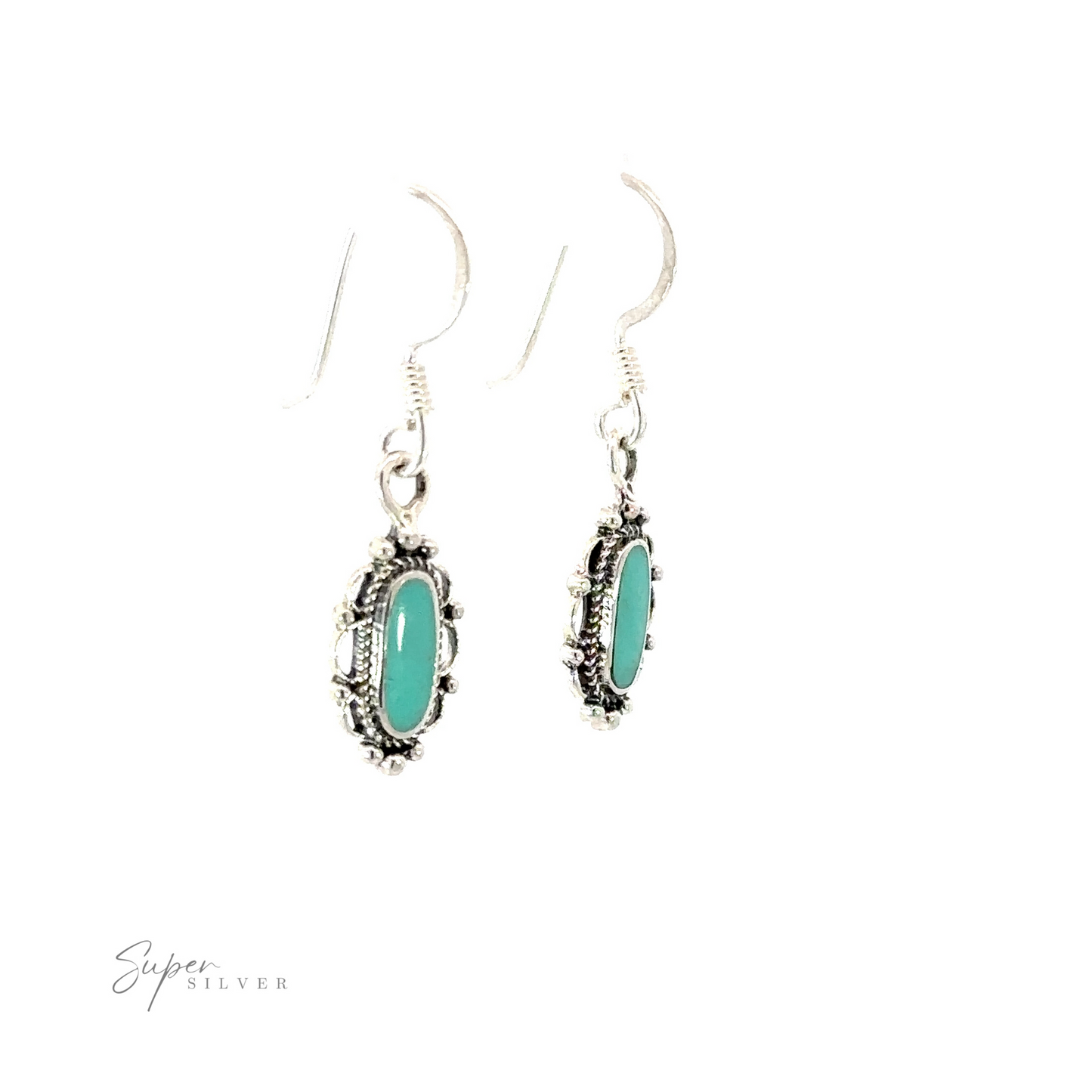 
                  
                    A pair of dainty vintage inspired oval inlaid stone earrings with turquoise stones.
                  
                