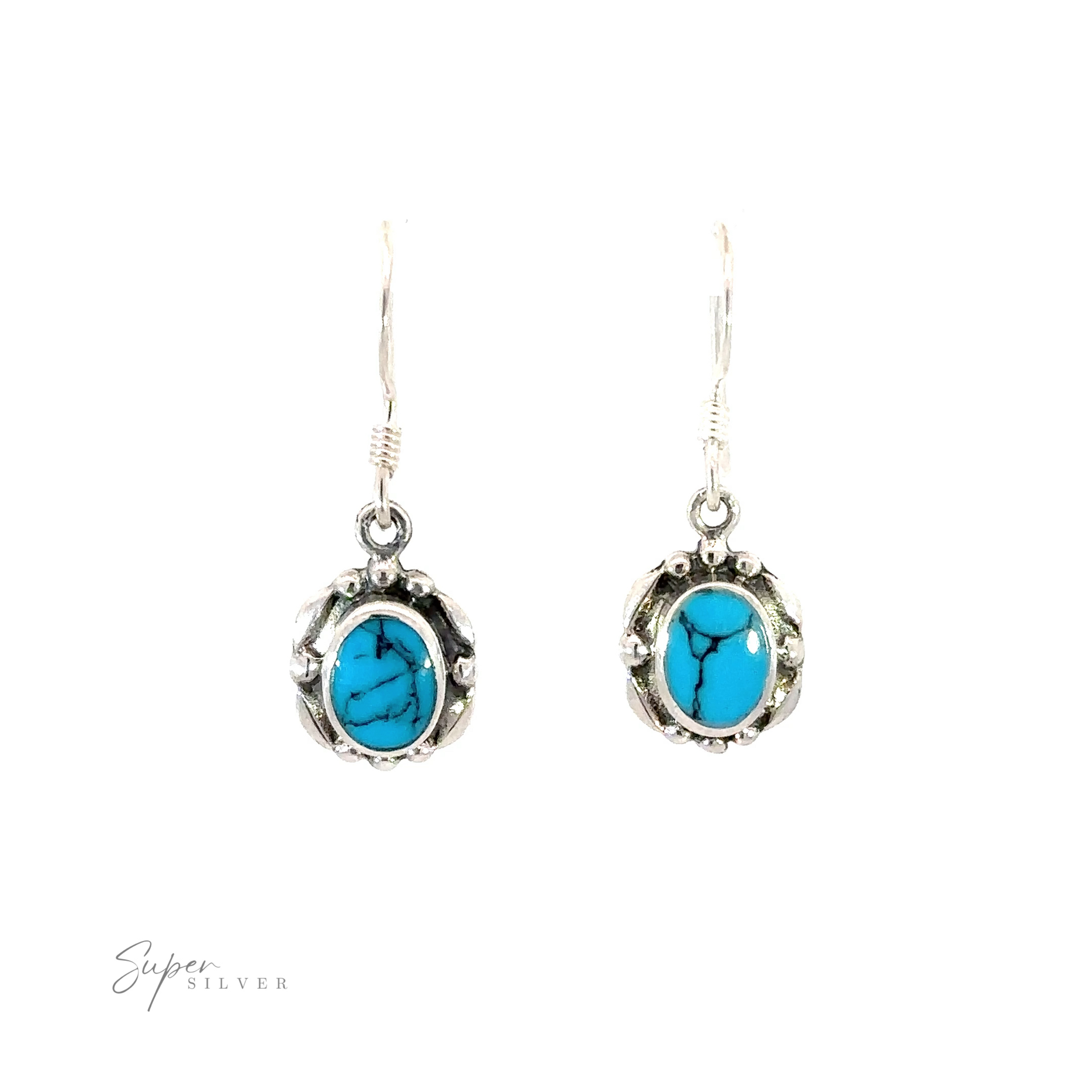 A pair of Oval Inlaid Stone Earrings with inlaid turquoise stones.