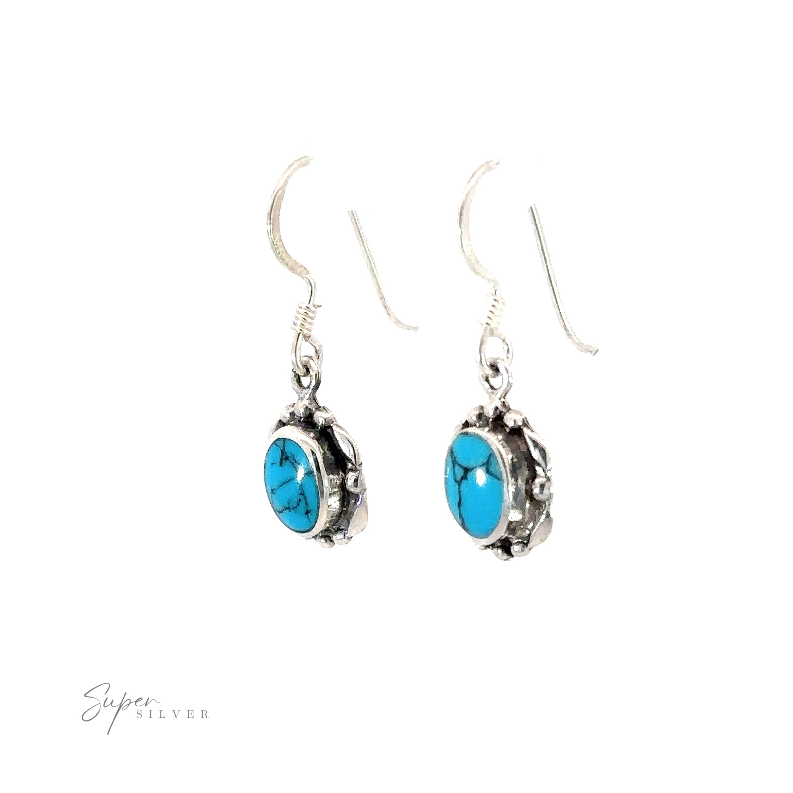 A stunning pair of Oval Inlaid Stone Earrings with turquoise stones elegantly inlaid.